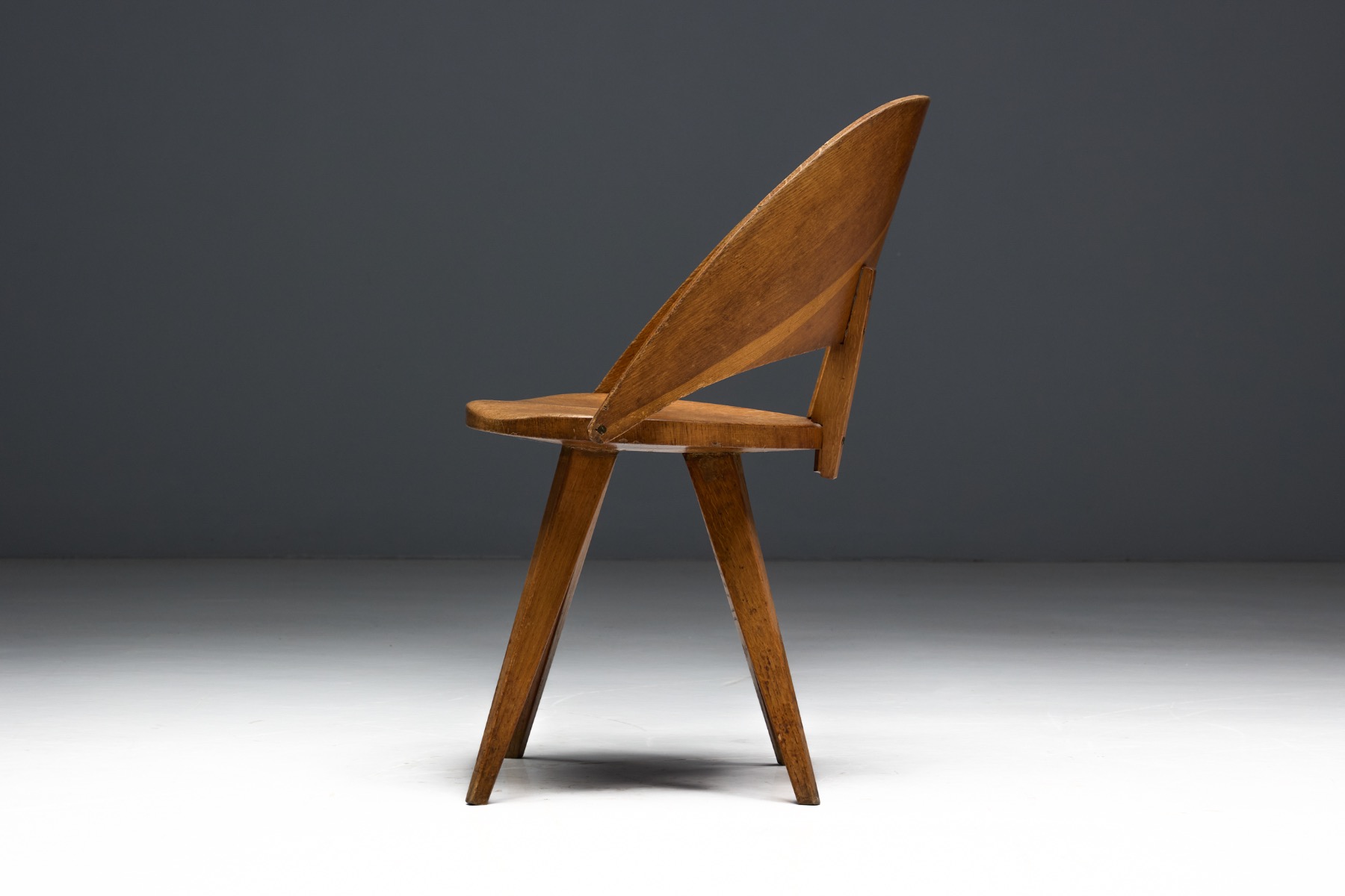 Minimal Italian plywood dining chairs with modern proportions