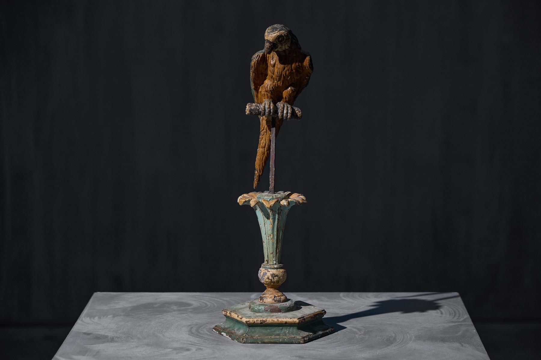 Collectible antique parrots with carved detailing