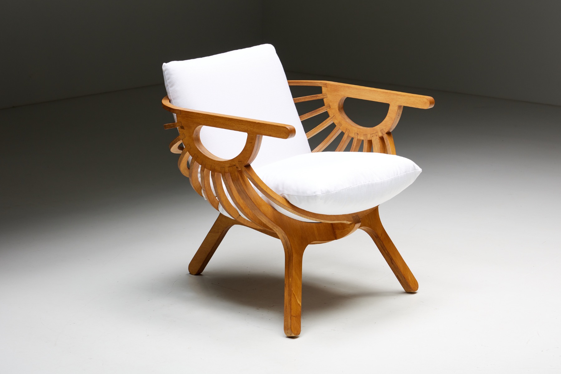 Minimalist shell lounge chair in sculptural style