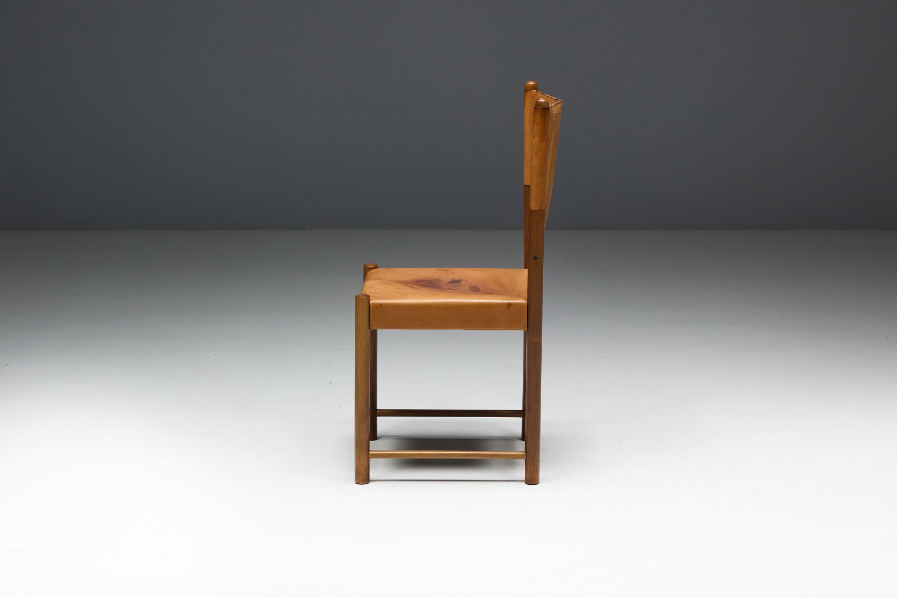 Refined cognac leather dining seating from the 1960s