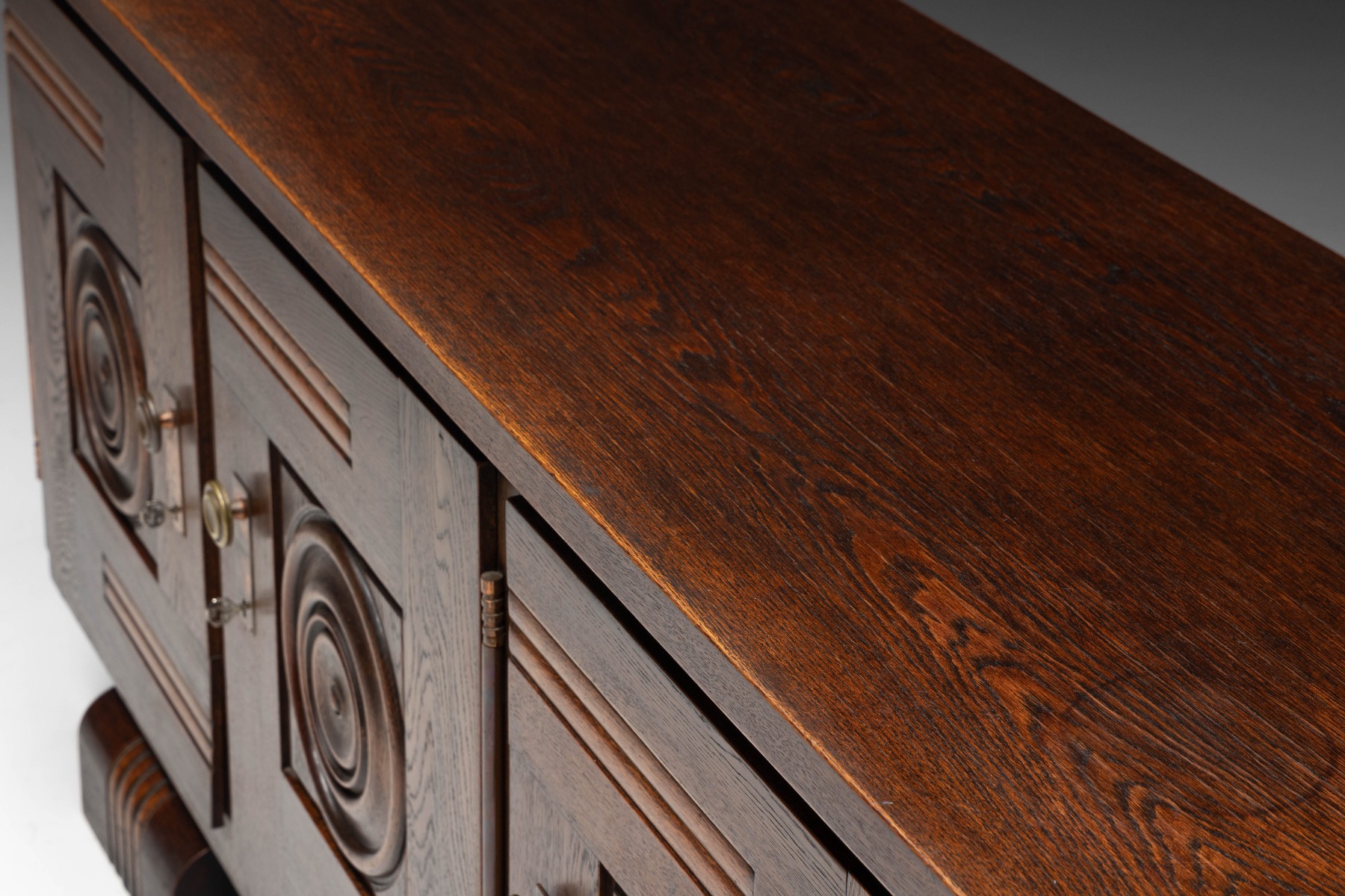French Art Deco sideboard with circular carved motifs