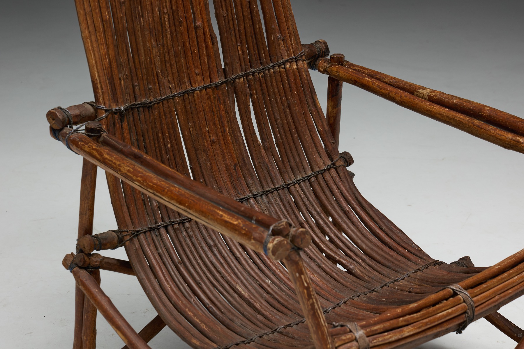 Museum level rustic wicker reclining chairs from the mid 20th century