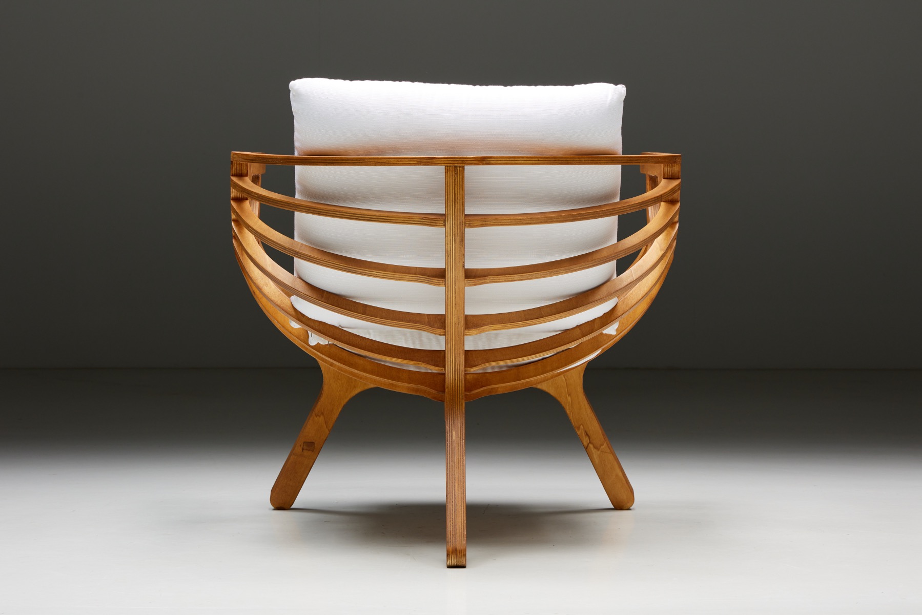 Curved shell lounge chair in sculptural form