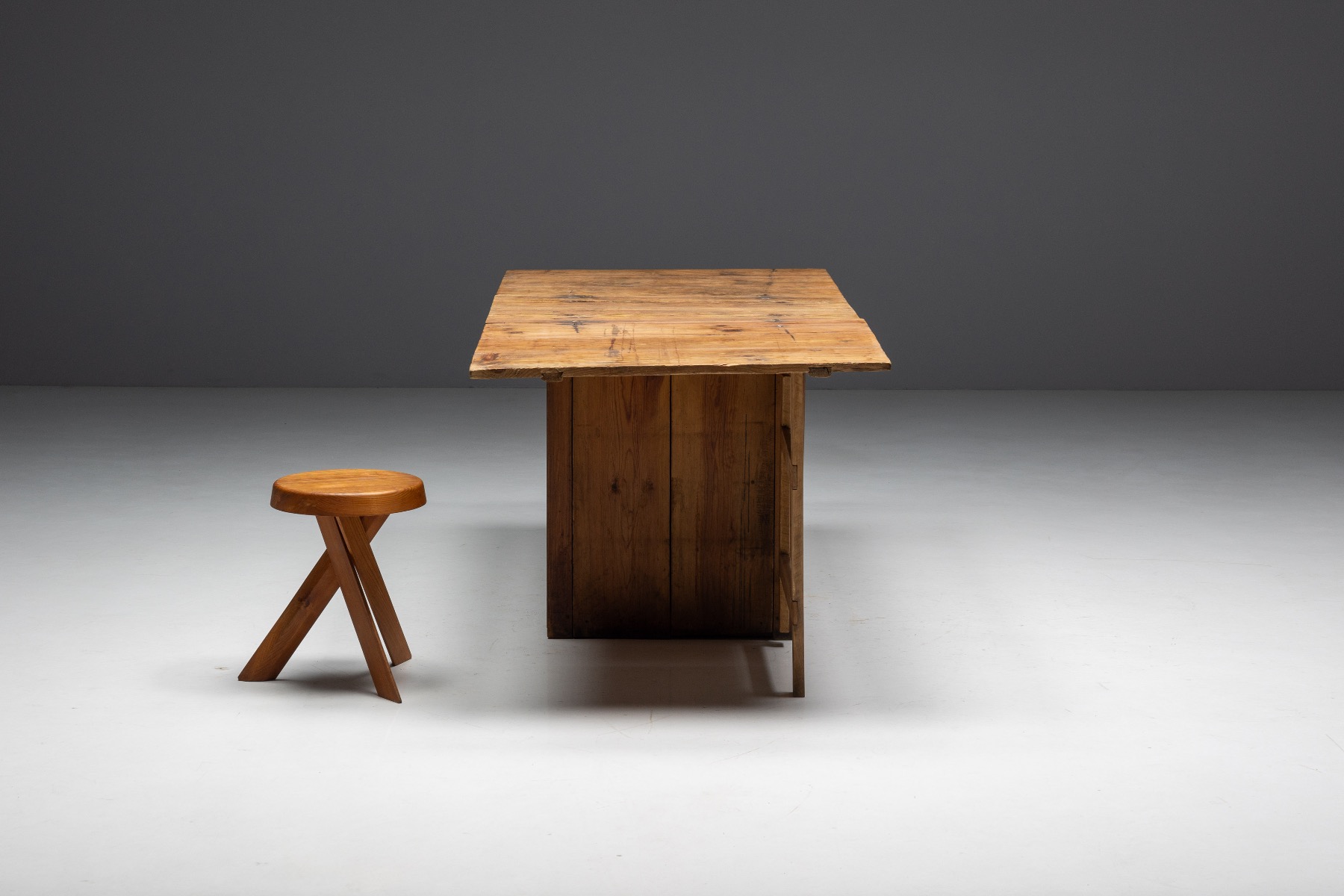 Utilitarian wooden worktable featuring drop leaves