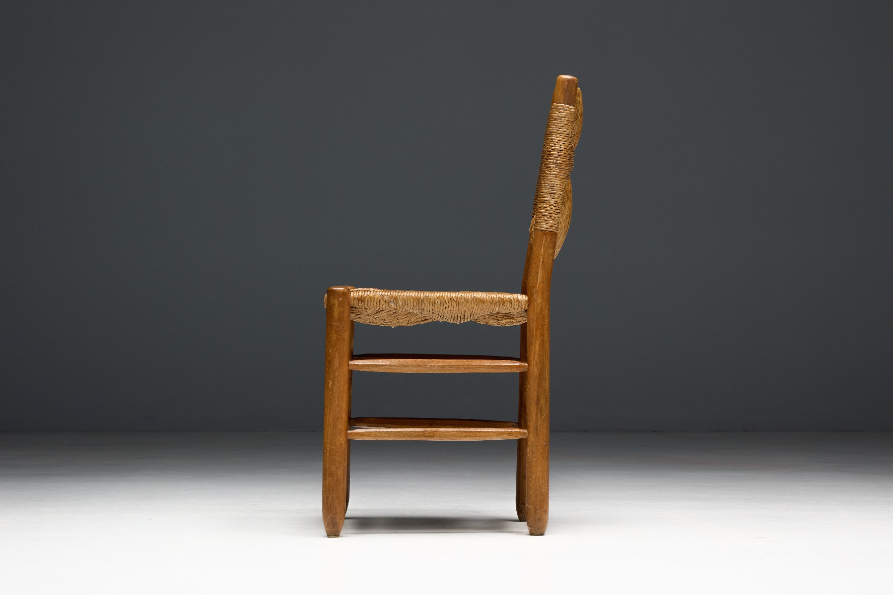 Museum level Bauche dining chairs by Charlotte Perriand