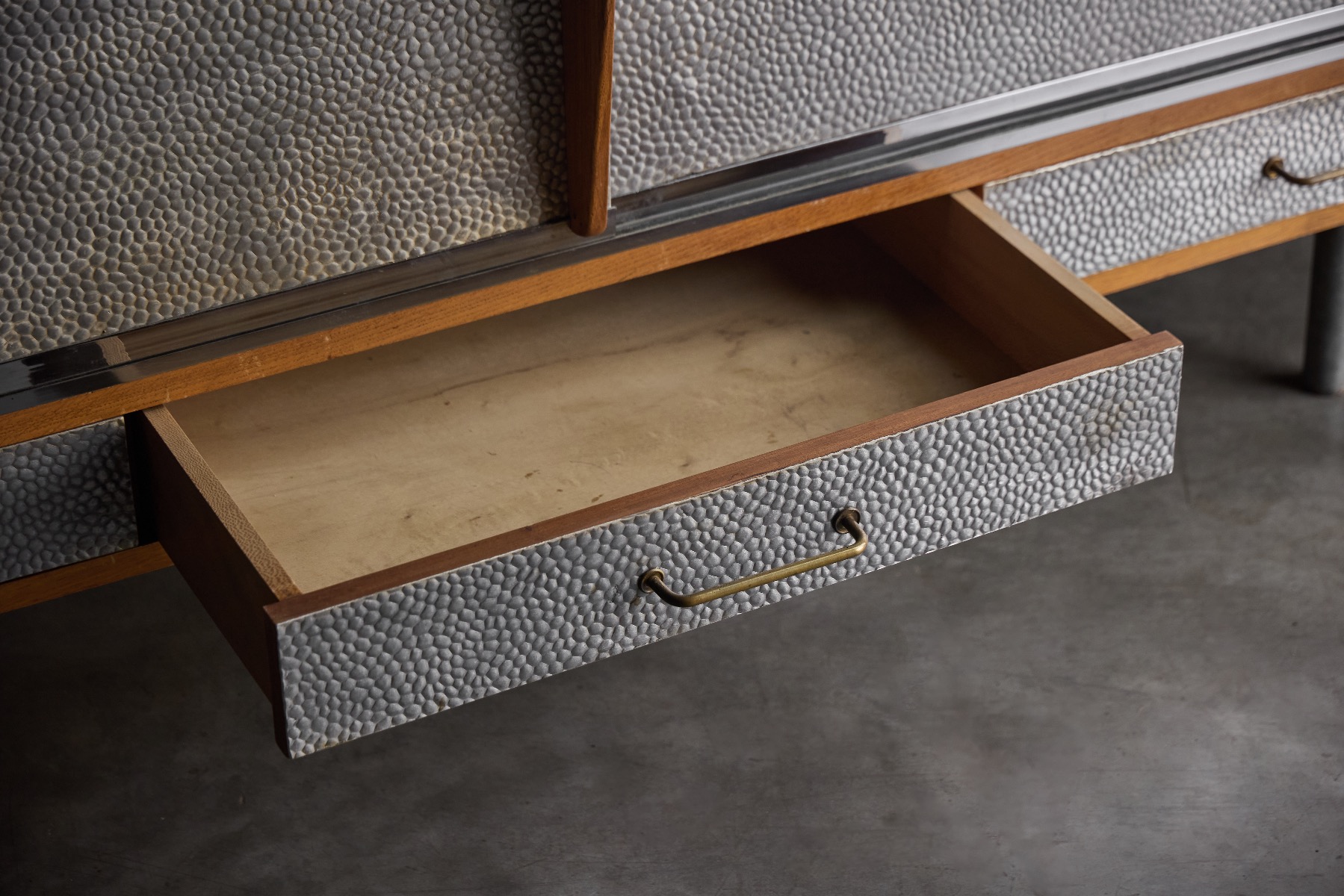 1960s mid century sideboard featuring a hammered metal front