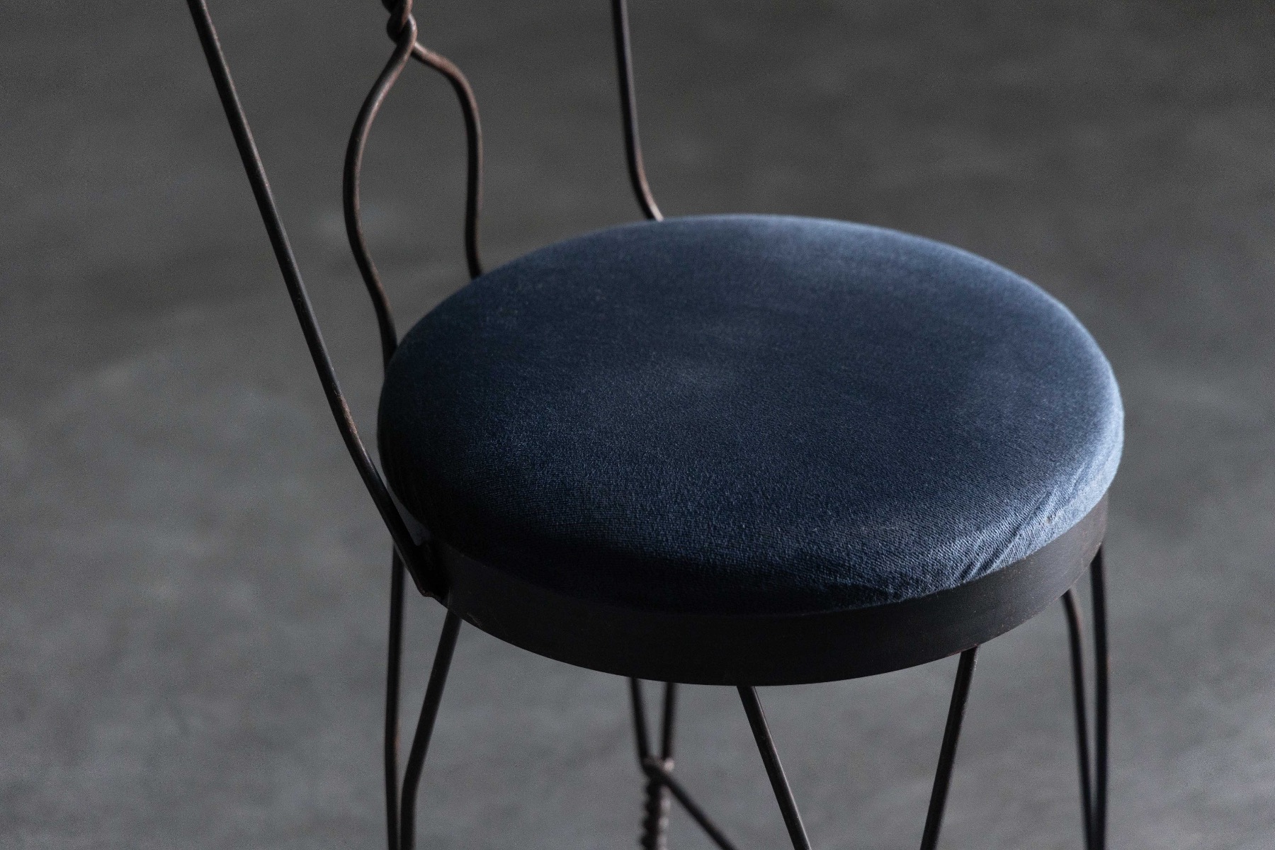 1960s butterfly dining chair with sculptural wrought iron frame