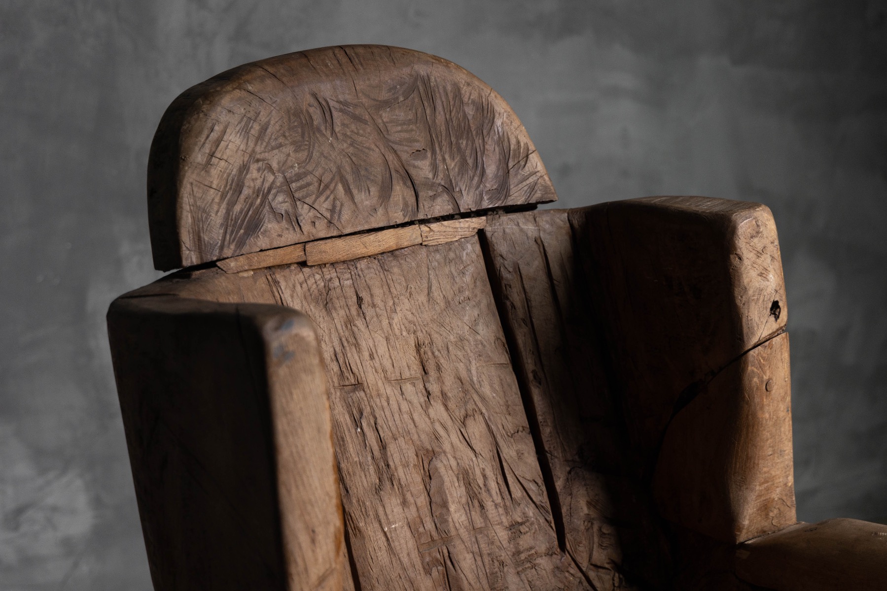 19th century throne chair carved from a single block of wood