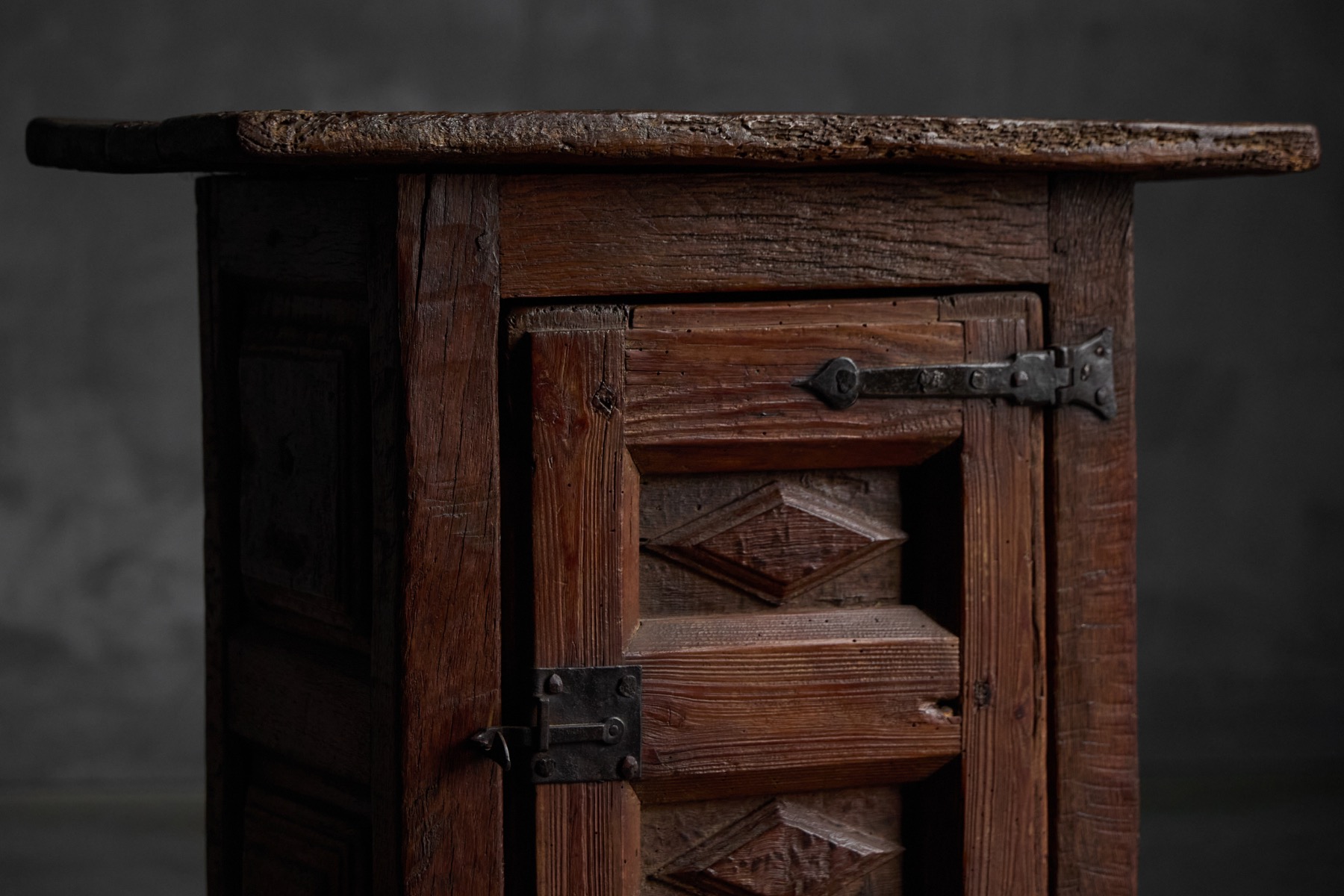 19th century rustic oak cabinet with timeworn patina and paneled side