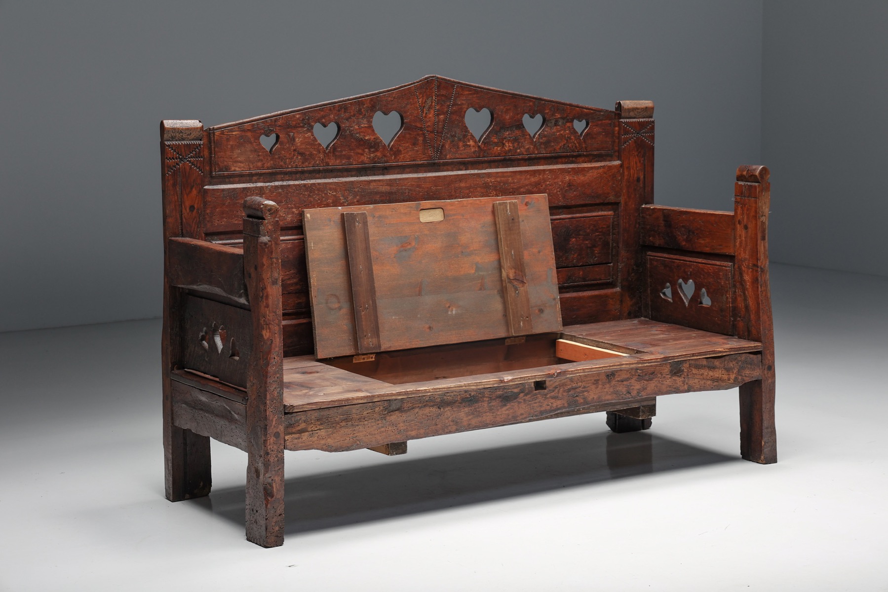 Antique carved bench with storage compartment in wood