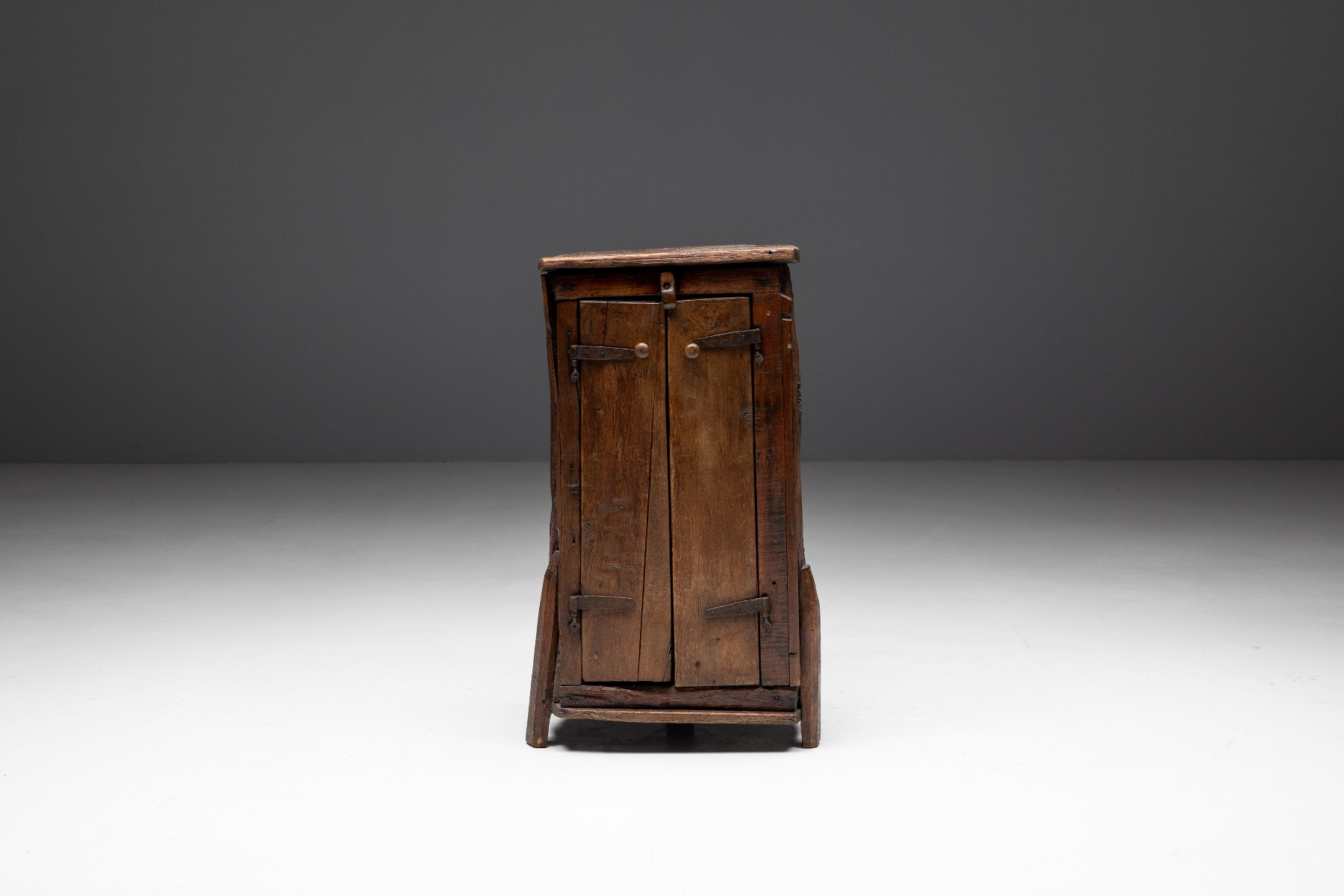 Antique monoxylite cabinet in folk style