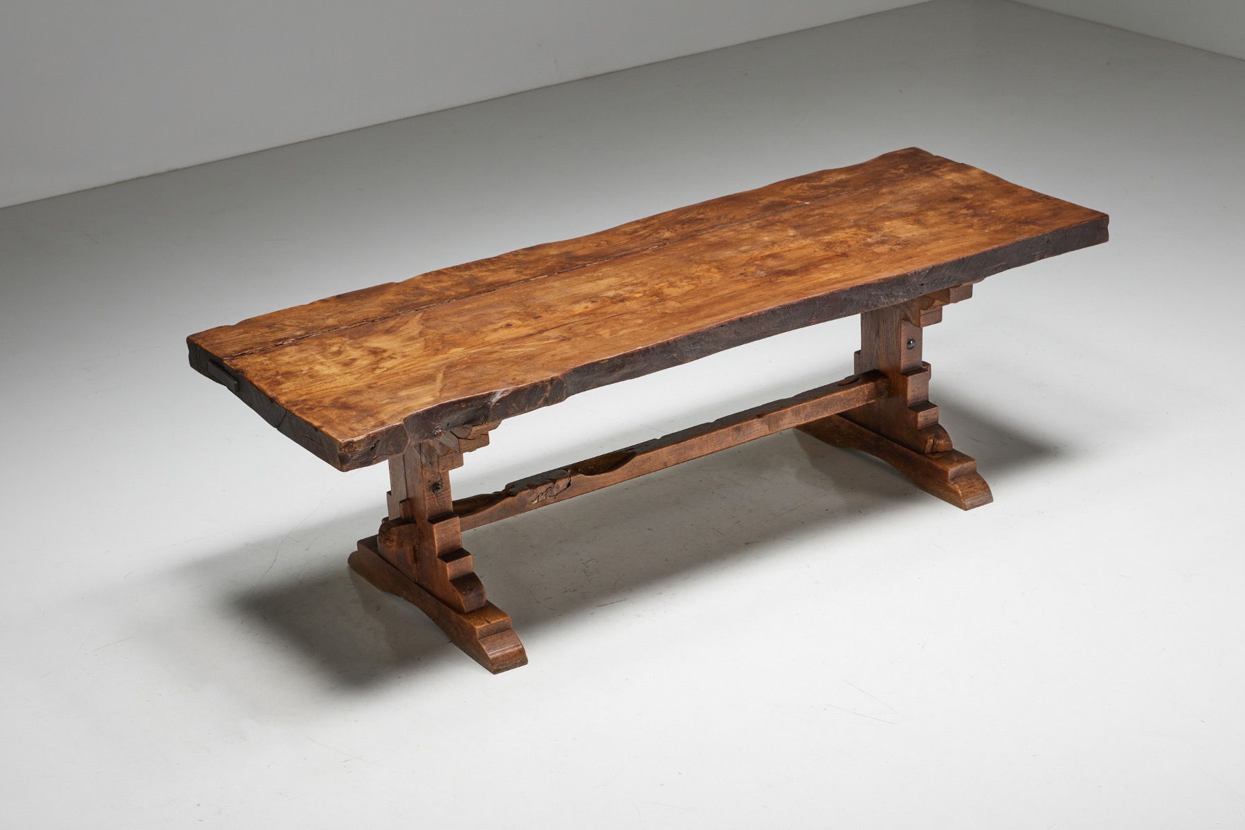 Antique rustic dining table in solid wood brutalist style