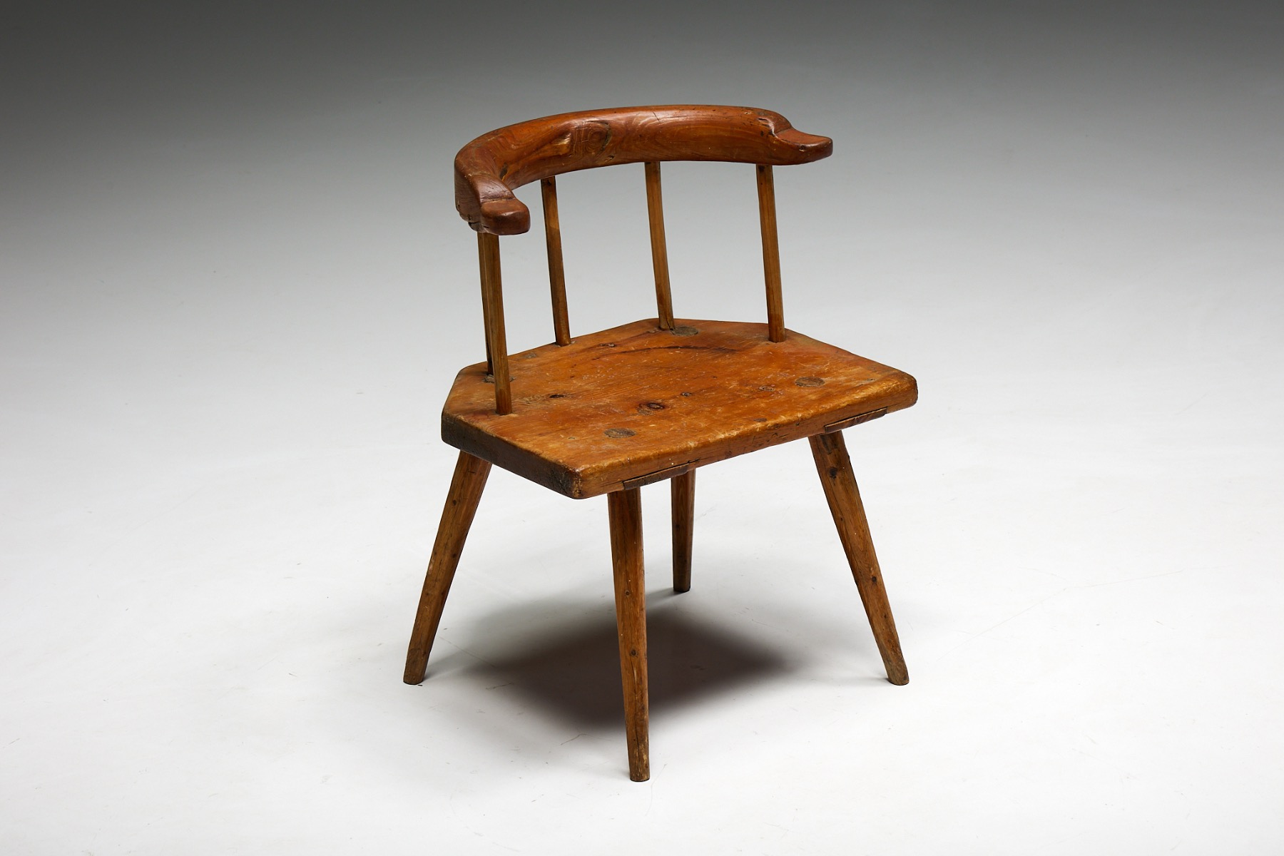 Antique Tyrolean wooden armchair in folk style