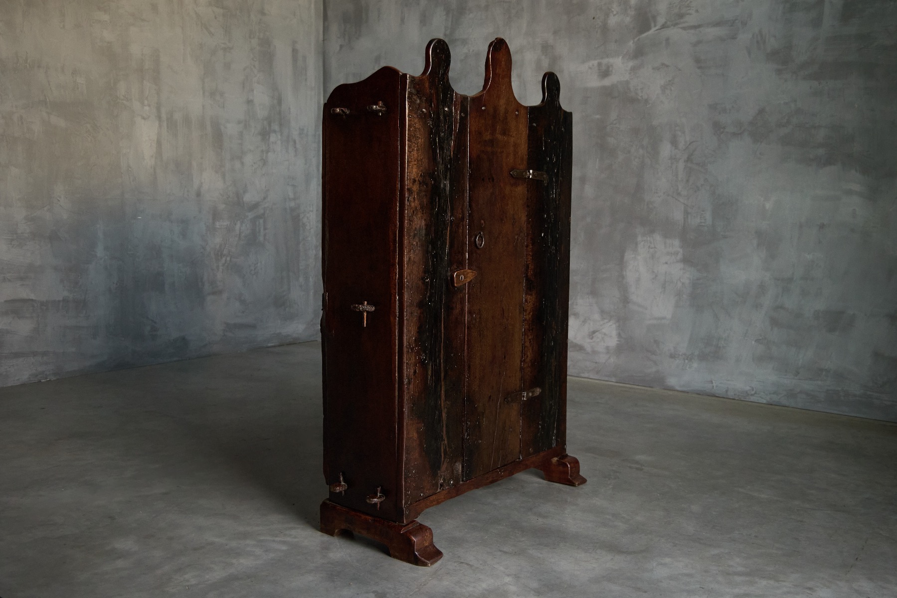 Antique vernacular wooden cabinet with aged patina