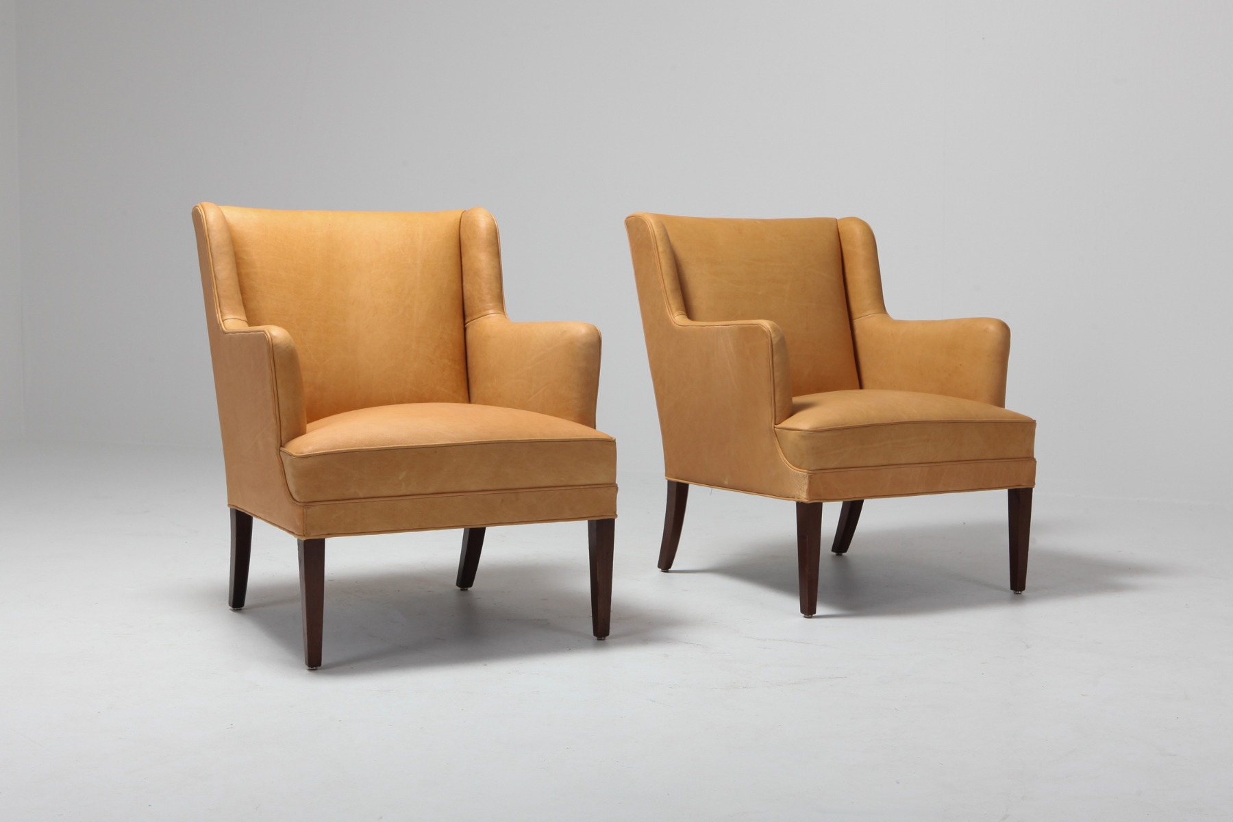 Camel leather bergere chairs in Scandinavian design from the 1960s
