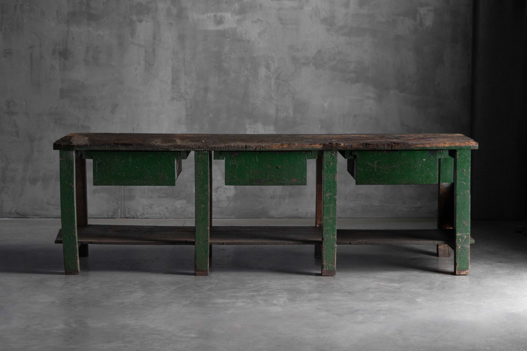 Early 20th century industrial workbench with utilitarian design