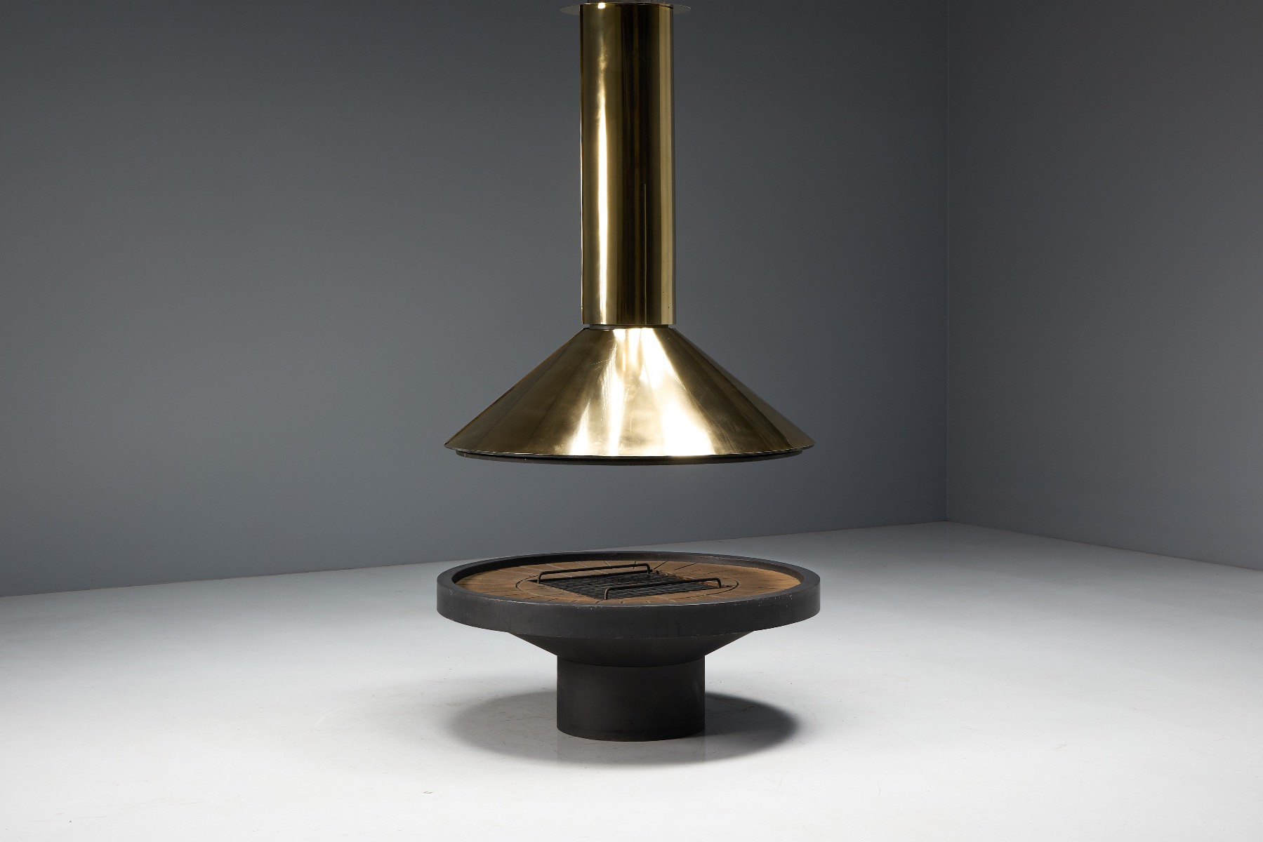 Freestanding brass fireplace with late mid century design