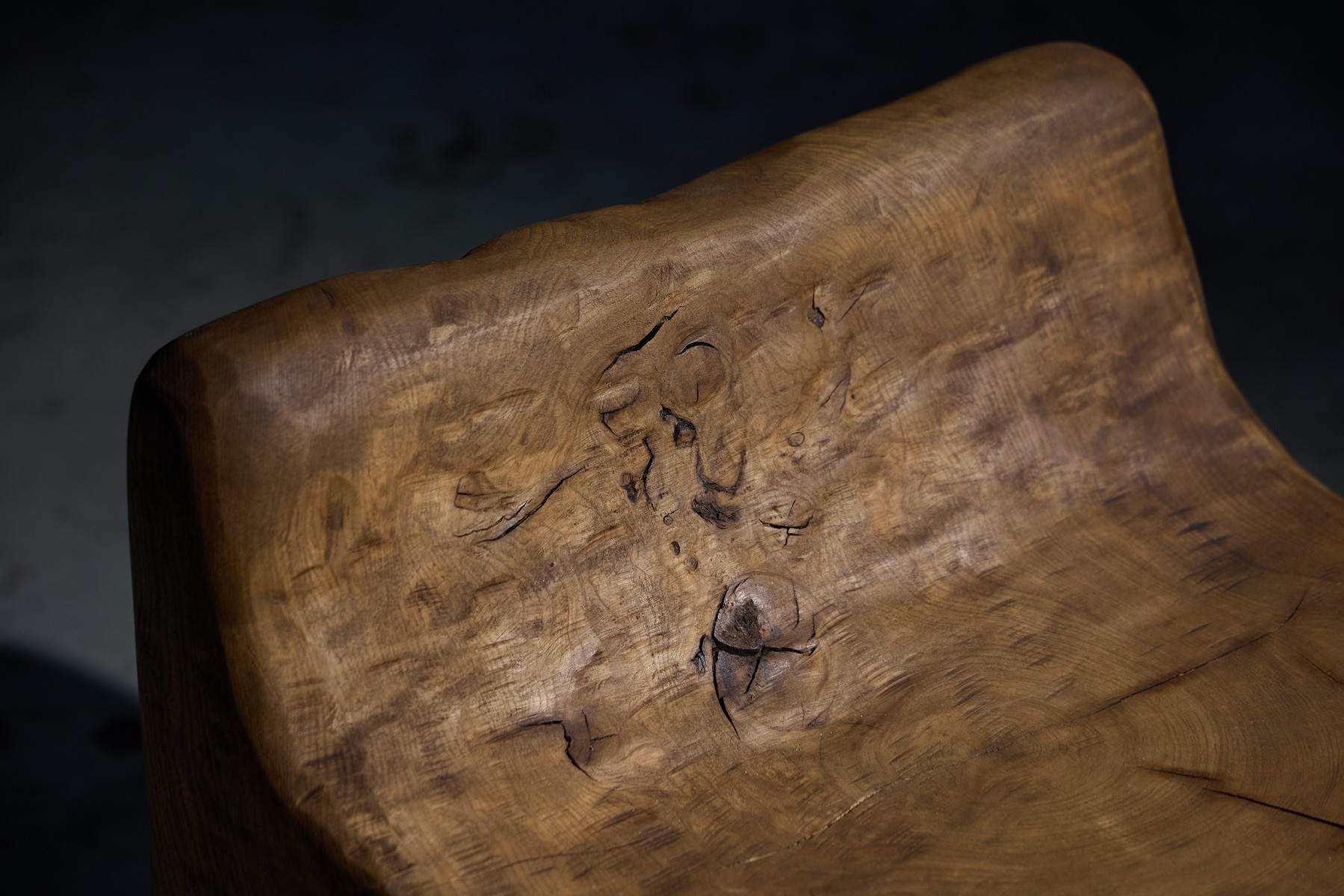 Contemporary brutalist chair carved by hand in solid wood