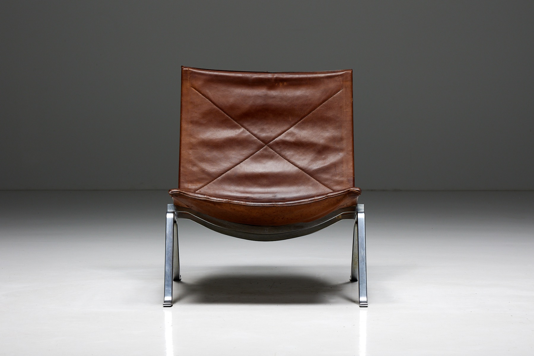 Poul Kjaerholm PK22 lounge chairs in cognac leather