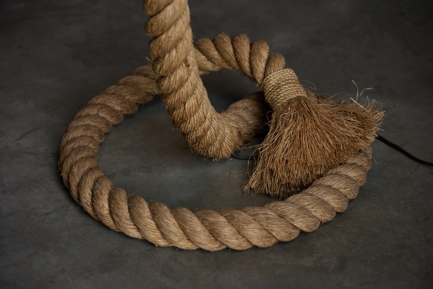 Vintage rope floor lamp featuring a natural jute shade