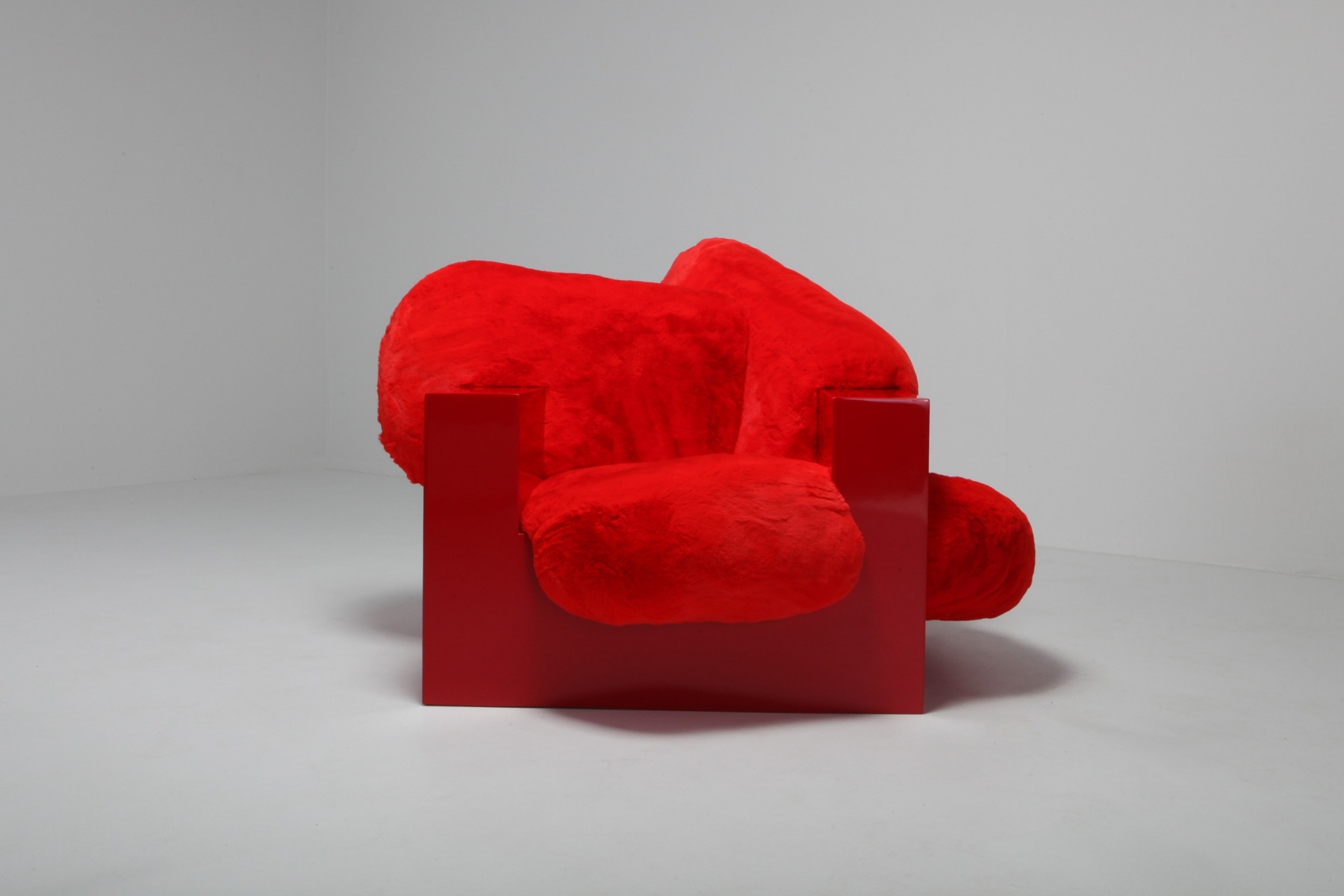 Schimmel Schweikle pillow lounge chair in red lacquer and faux fur from 2019 design