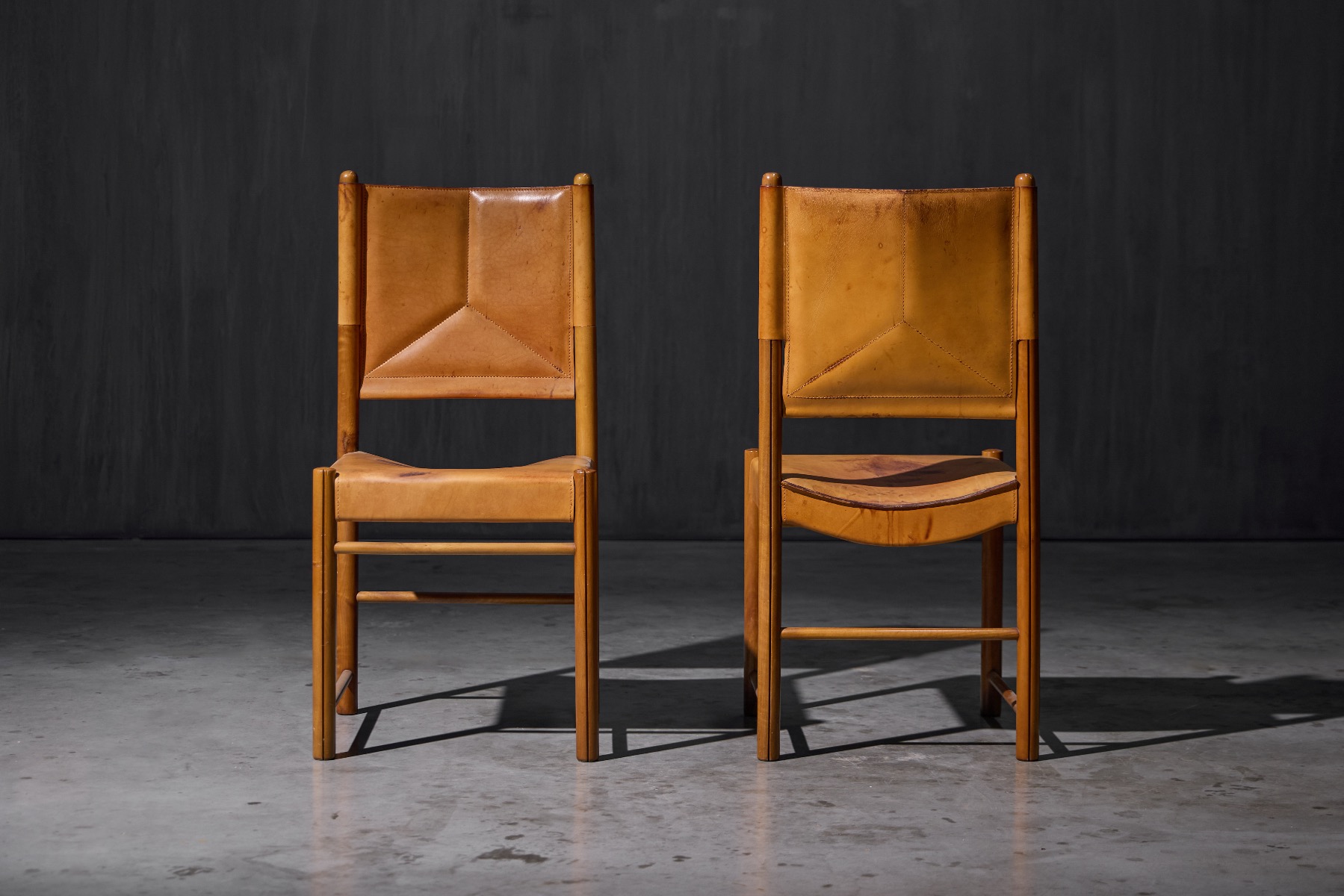 Vintage 1960s dining chairs upholstered in cognac leather