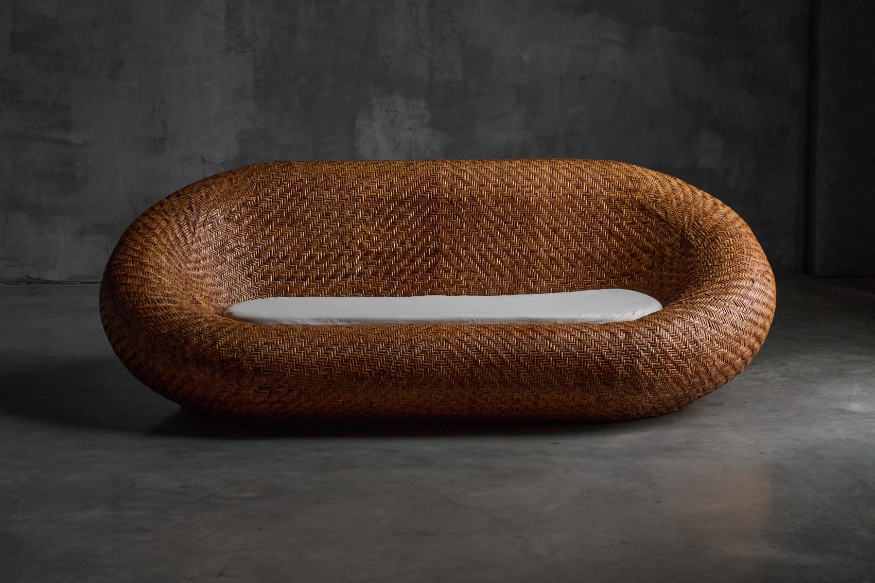 1970s woven wicker sofa with relaxed modernist design