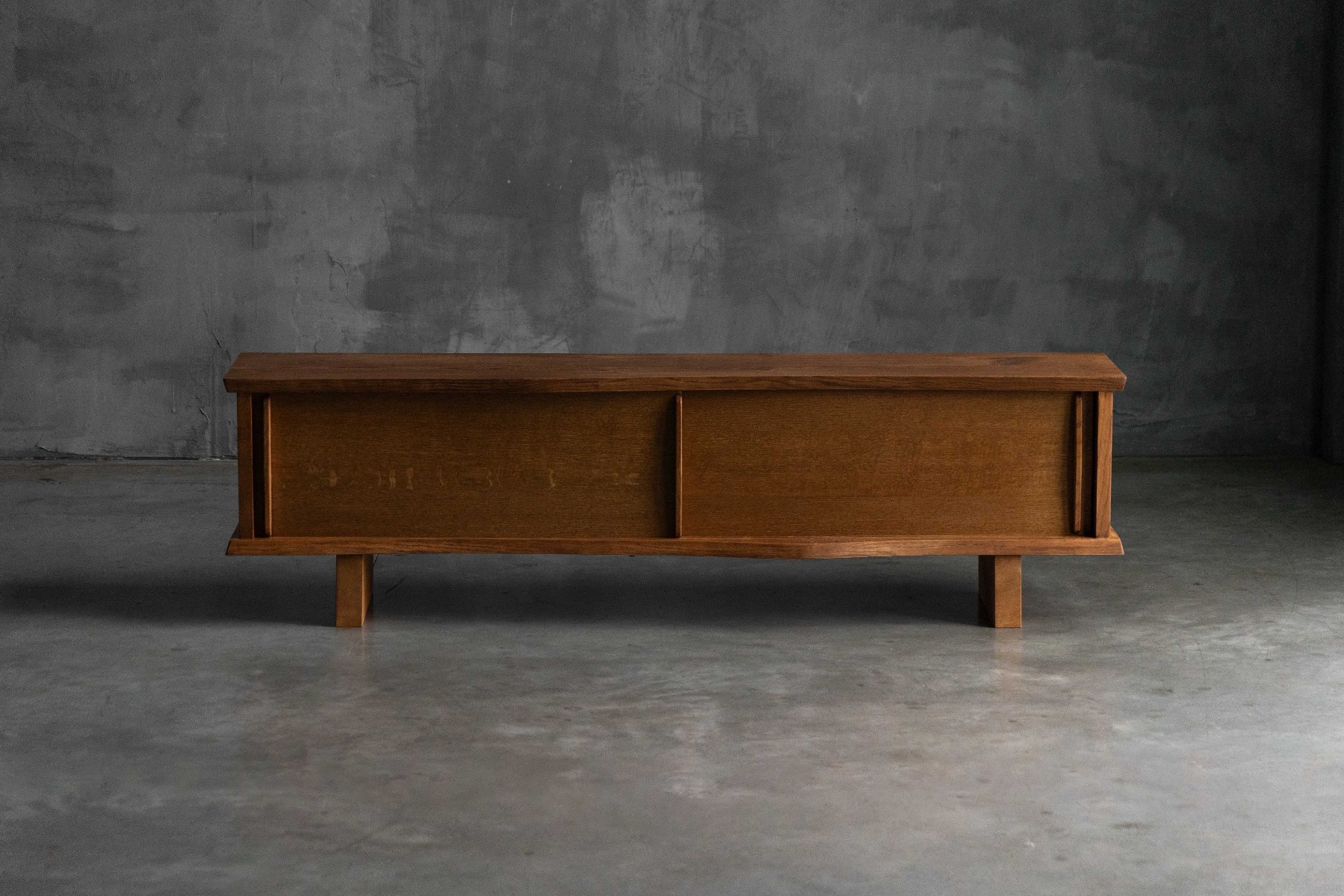1970s modernist sideboard featuring sliding panels in the Perriand Prouvé style