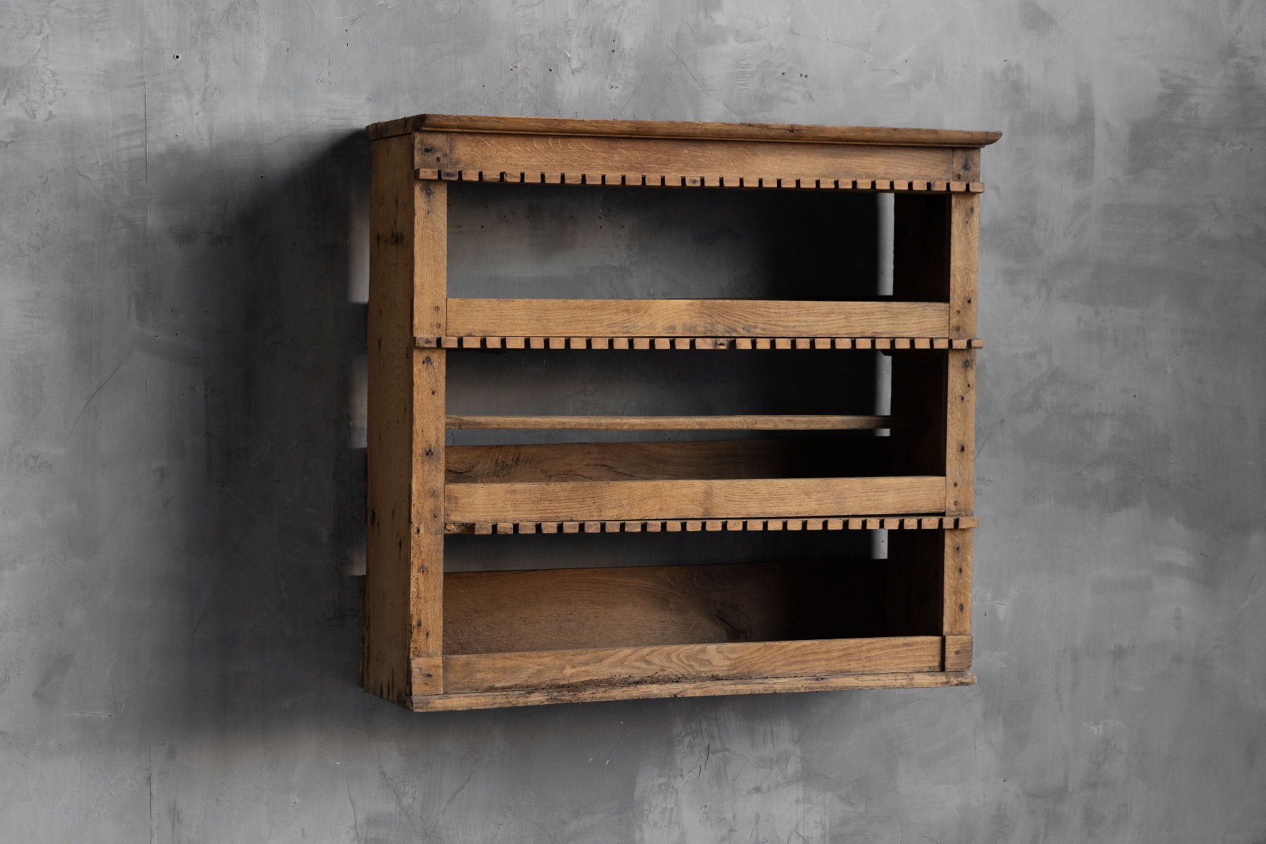 19th century rustic wall shelf with simple joinery and peg detailing