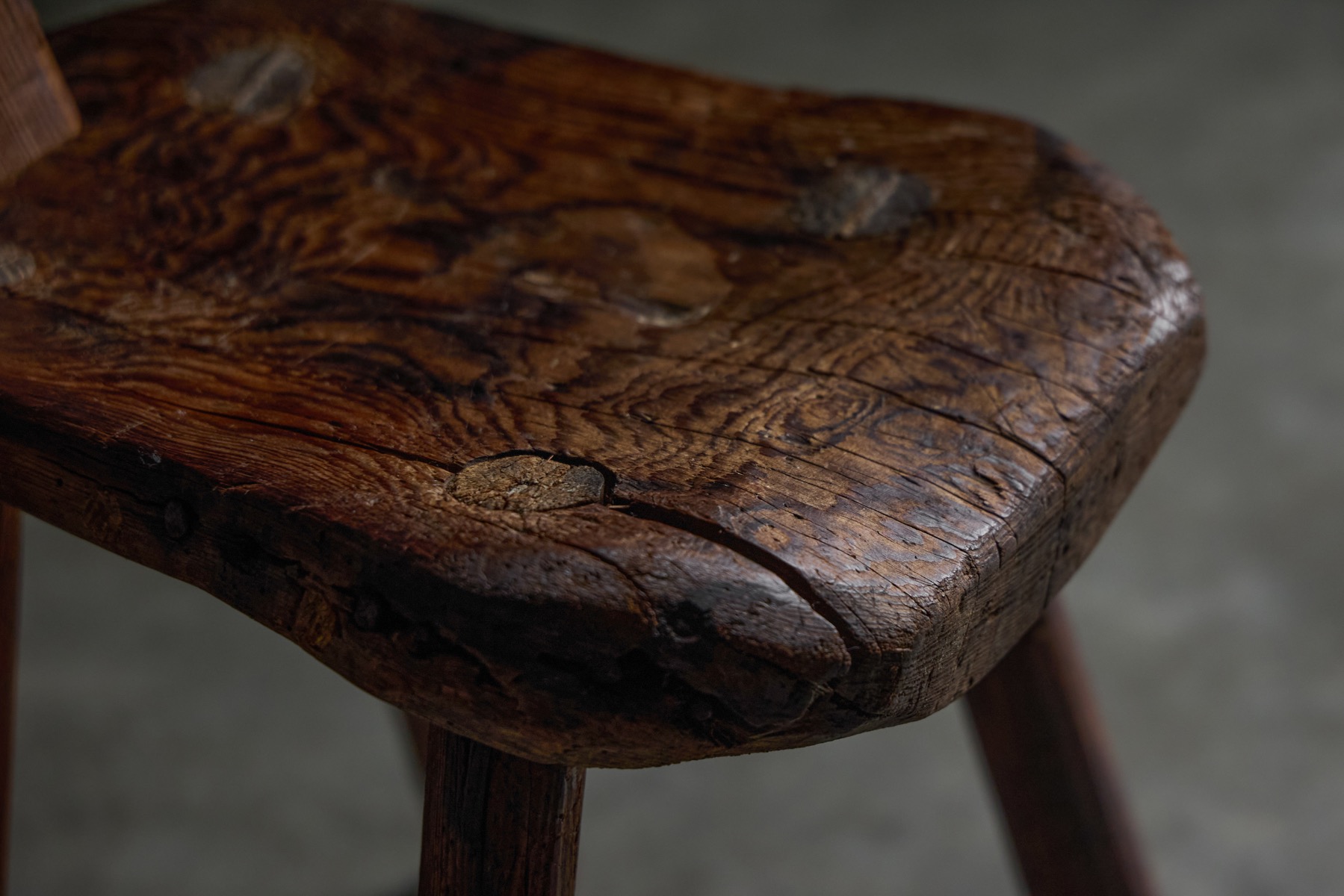 Antique Alpine folk chair with hand carved wooden details