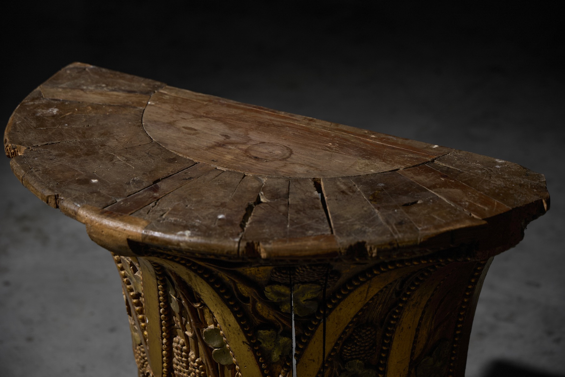 Antique demilune console with gilded wood finish