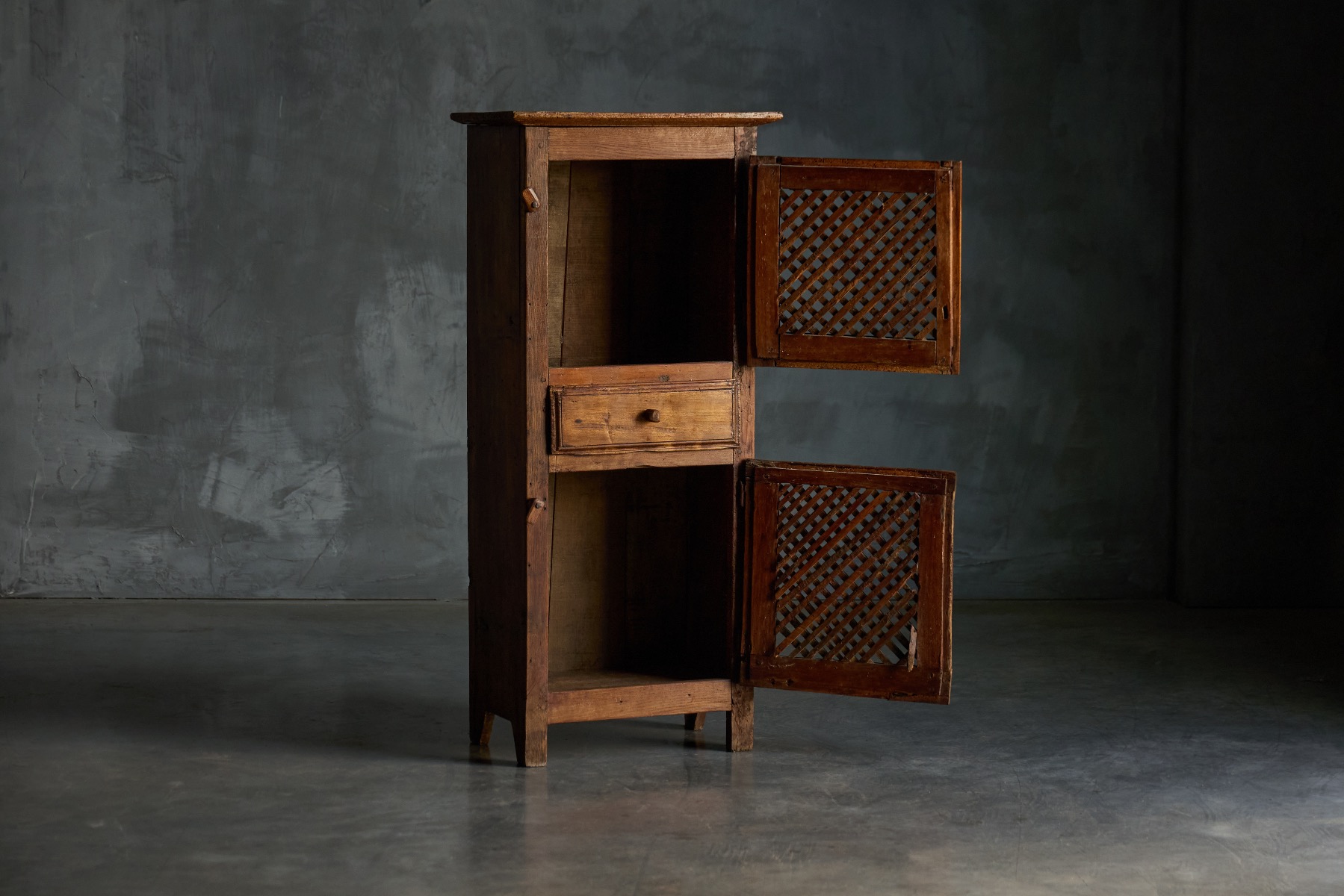 Antique folk art cabinet crafted in solid wood