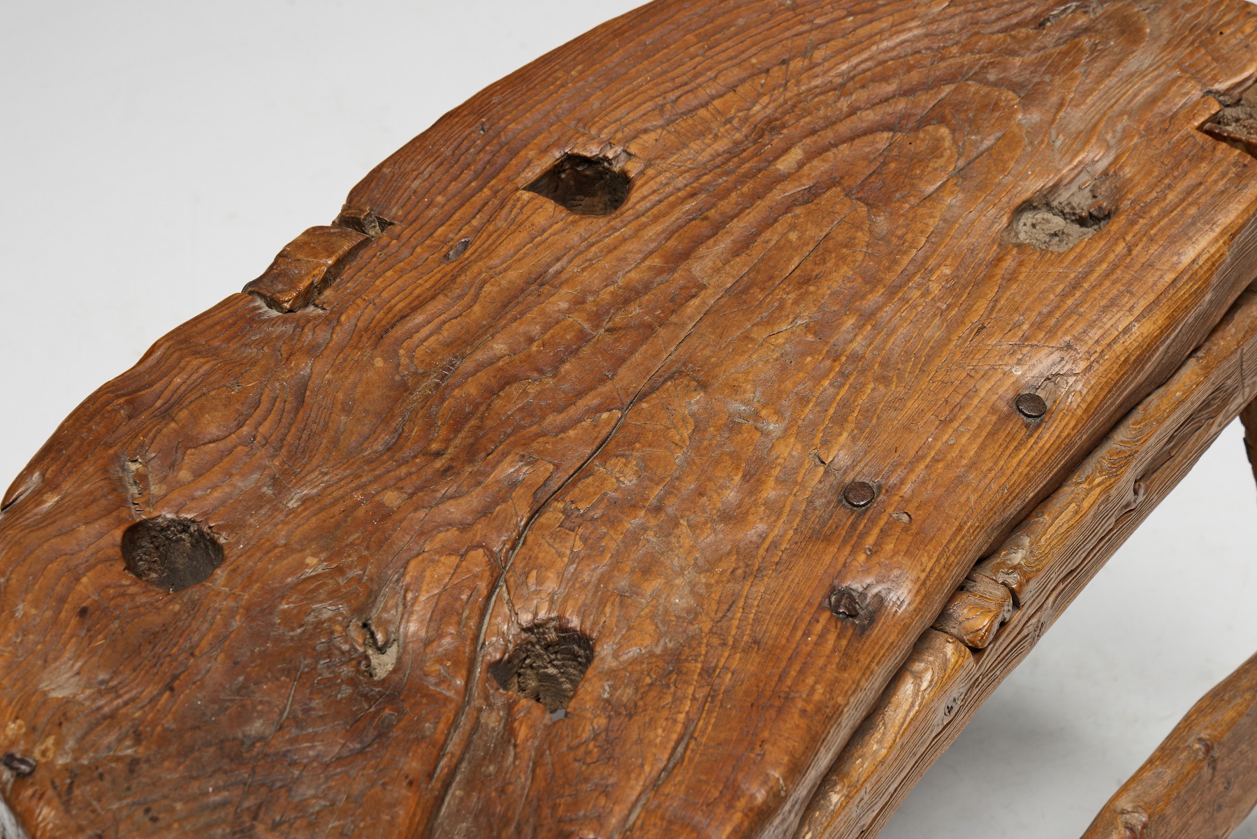 Antique organic tripod bench in rustic wood