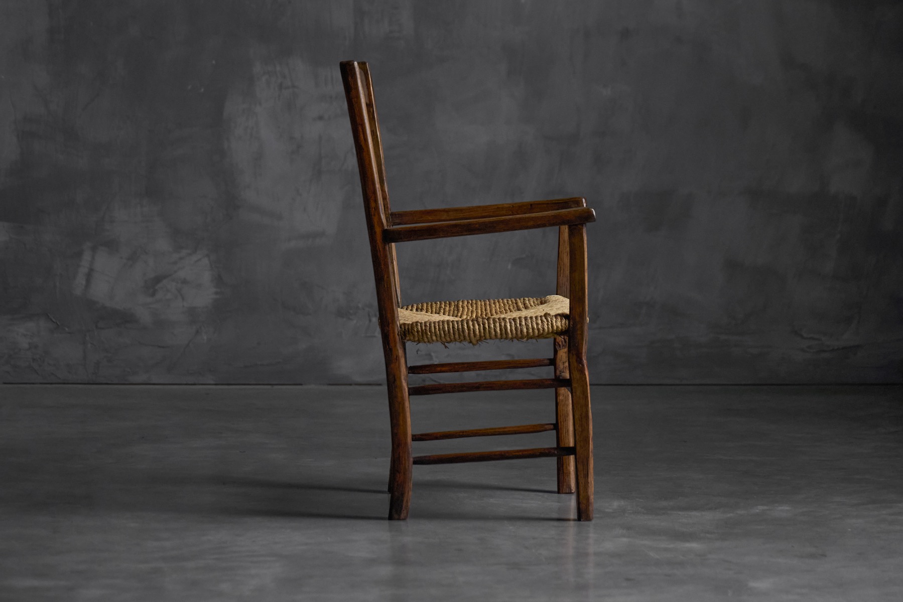 Antique rural armchair reflecting vernacular craftsmanship