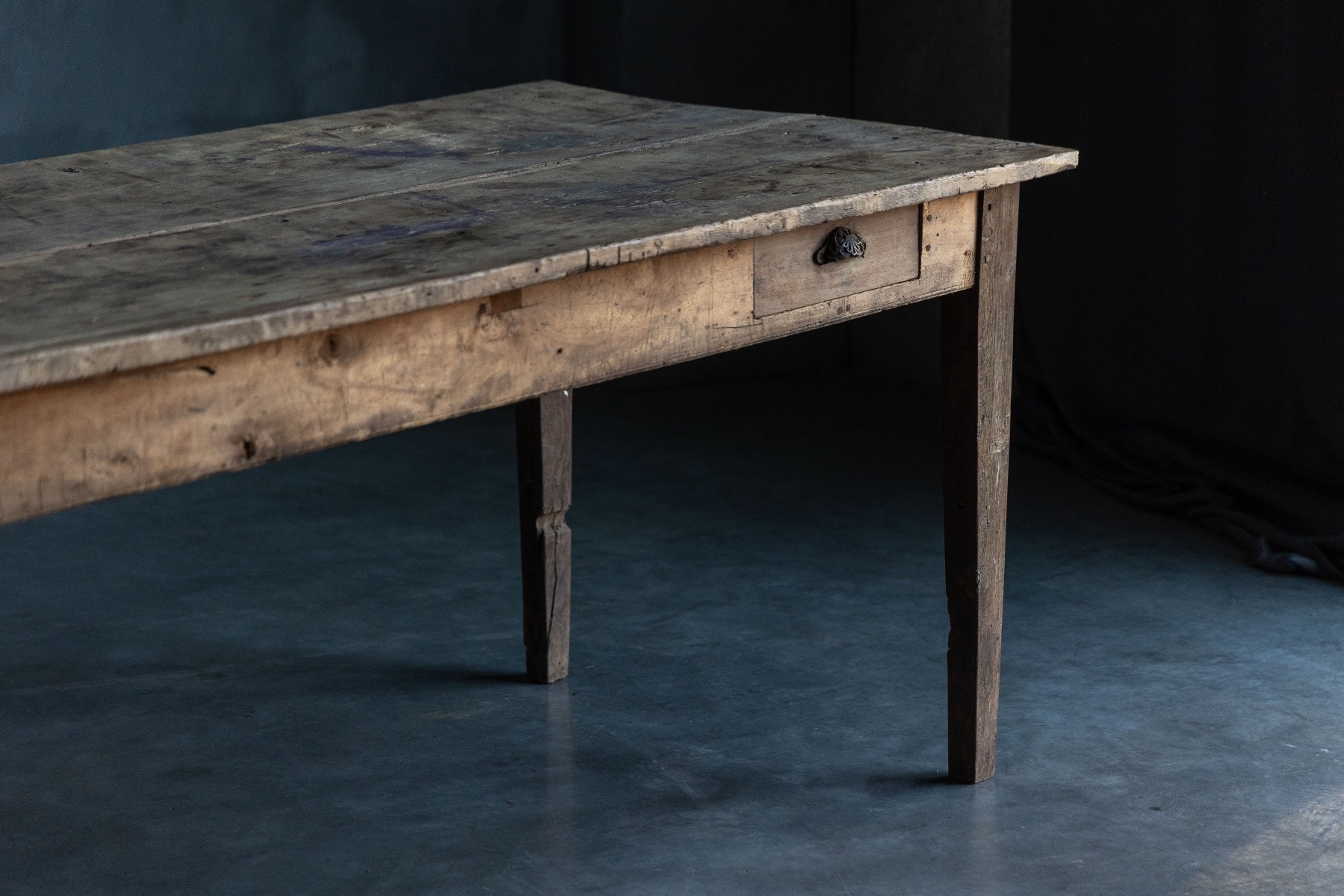 Antique country dining table crafted in wood