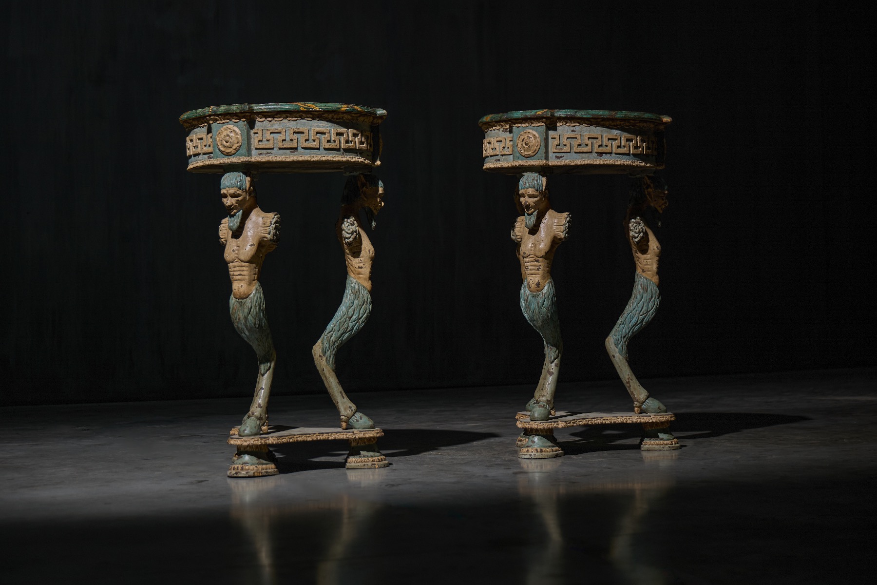 Antique tripod side table featuring satyr supports