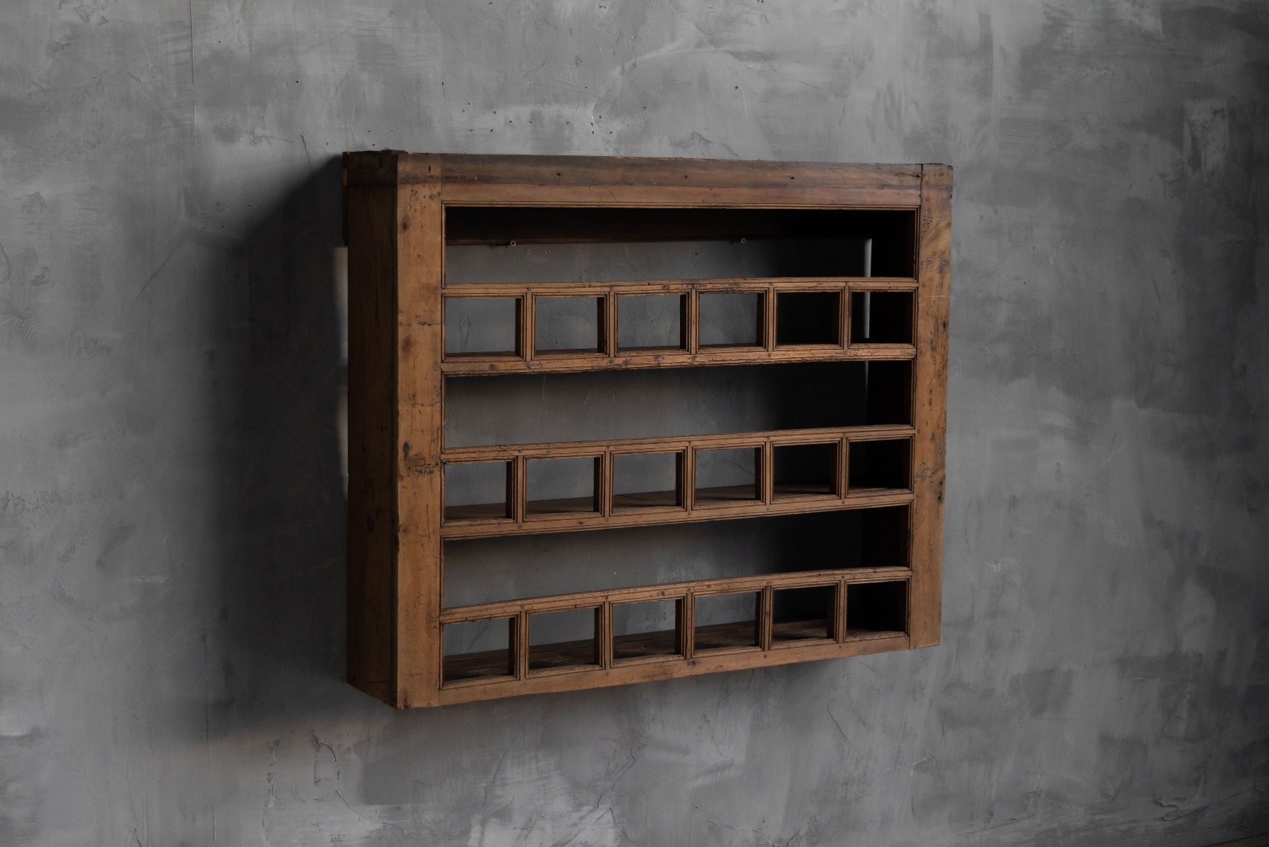 Antique vernacular wall shelf with simple rural construction