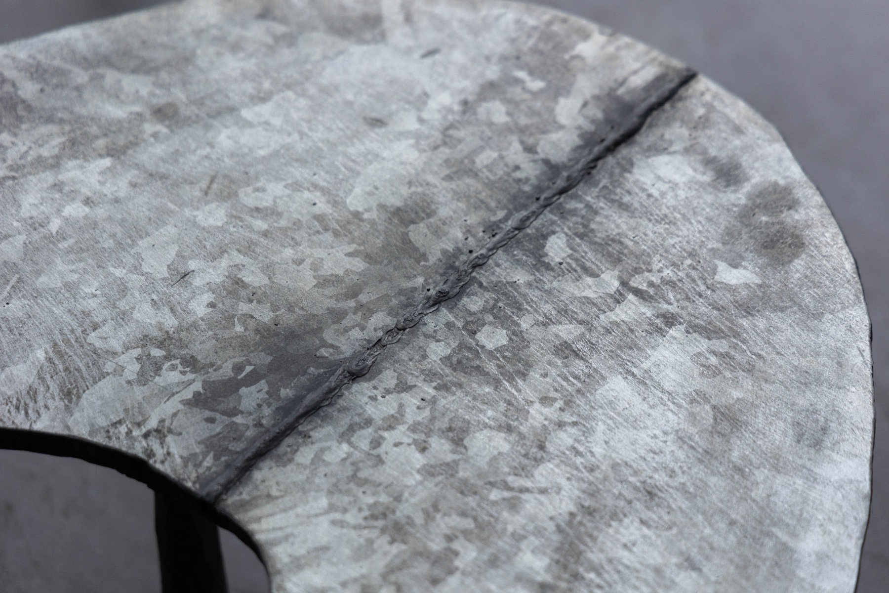 Sculptural elliptical coffee table designed by Atelier Serruys