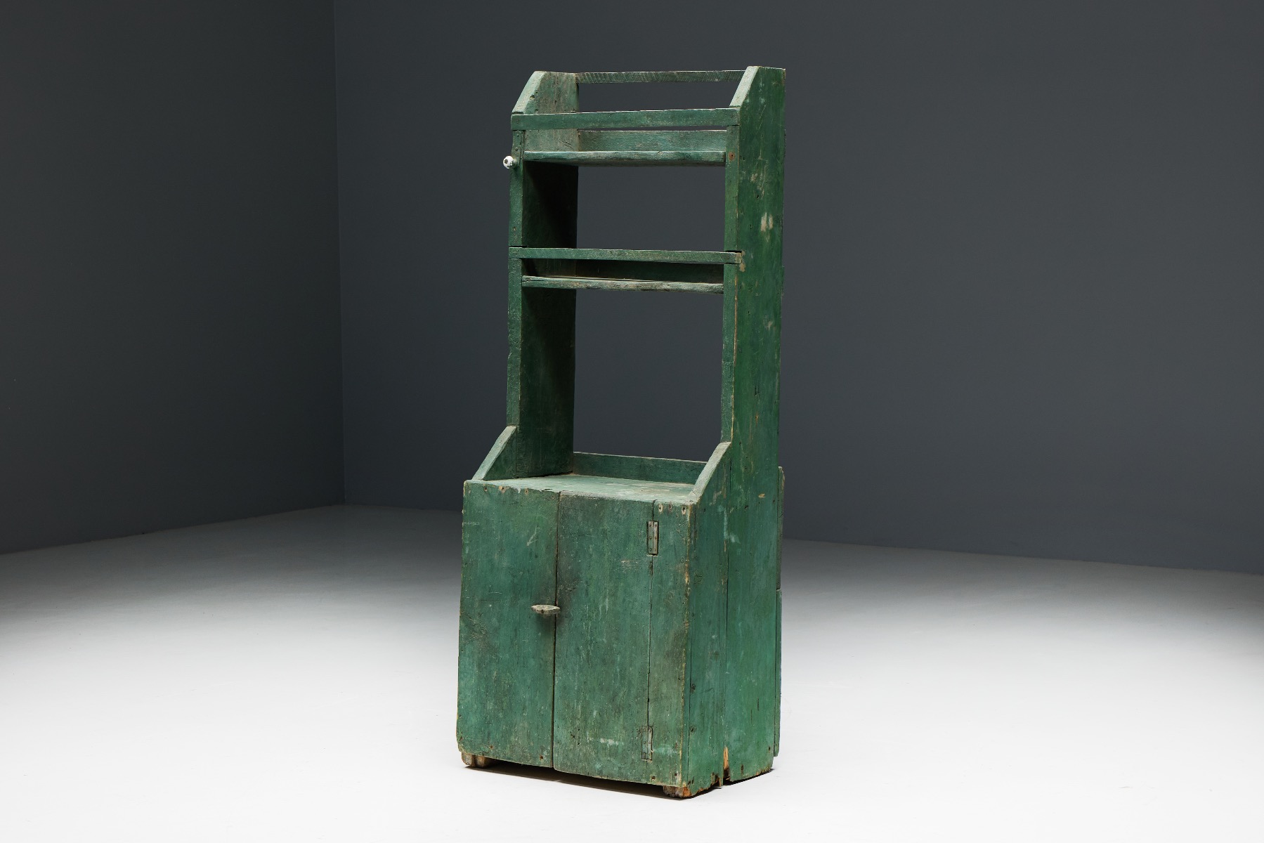 Handcrafted rustic wood cupboard in folk art style