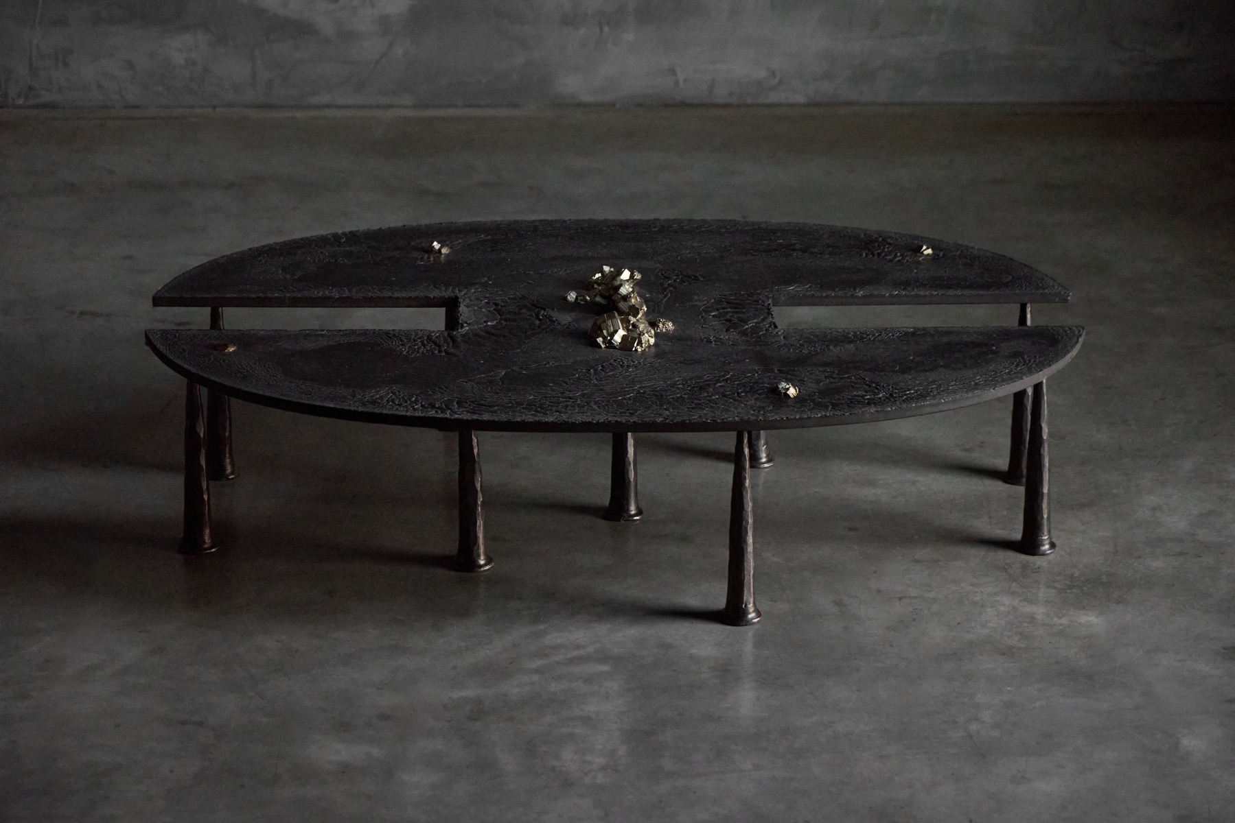 Iron brutalist coffee table featuring mineral inclusions by Thomas Serruys