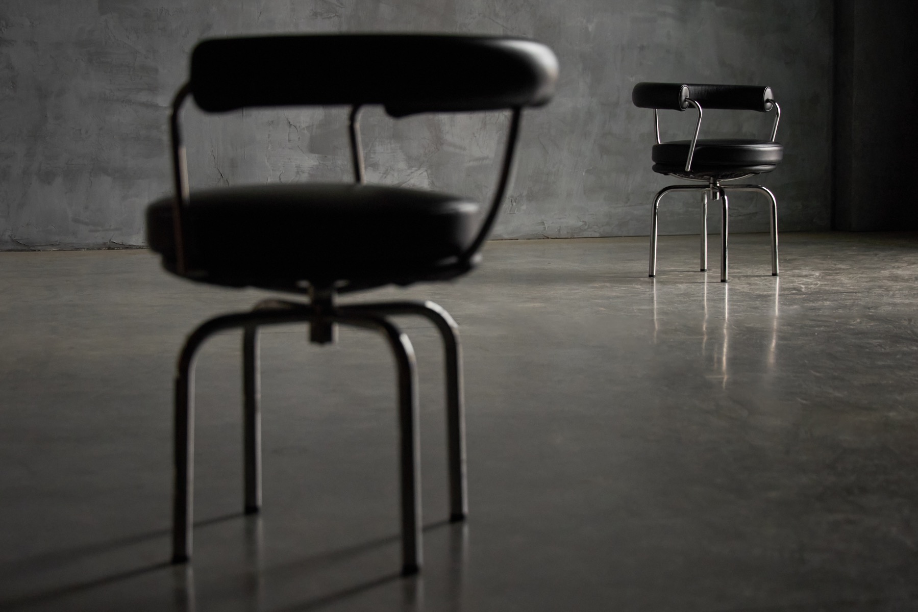 LC7 chairs with steel frame and upholstered seat by Cassina