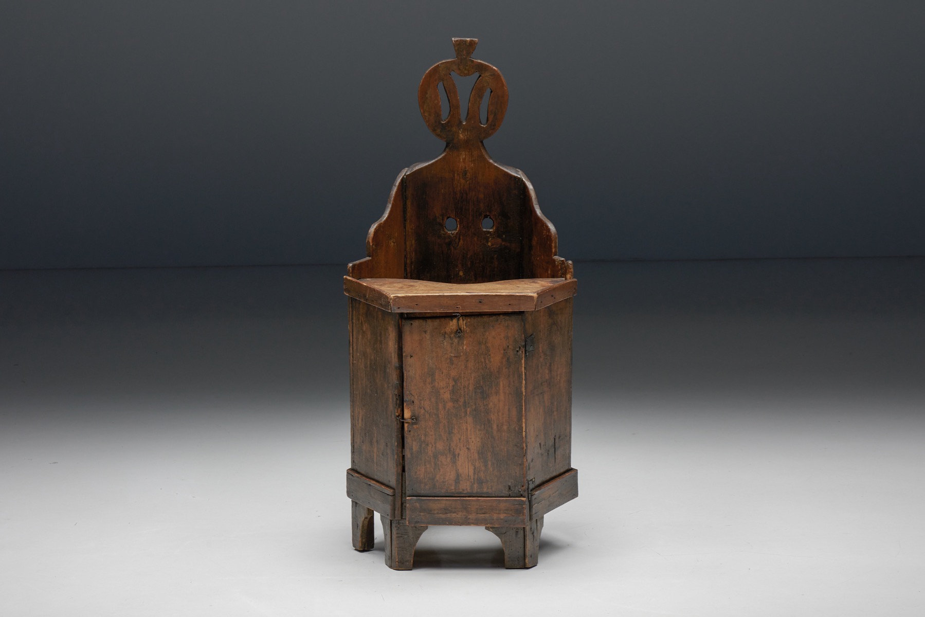 Primitive wooden child chair with hidden compartment