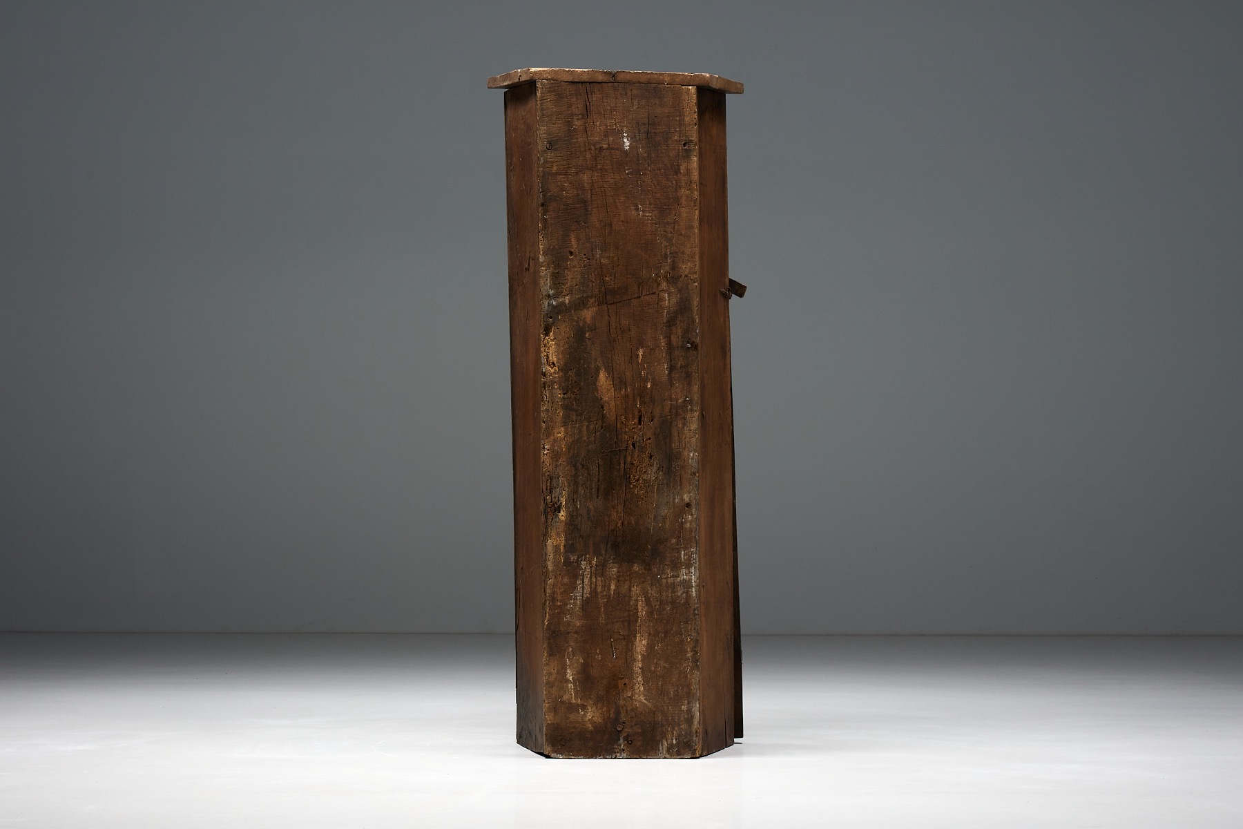 Primitive monoxylite wooden cupboard in folk style