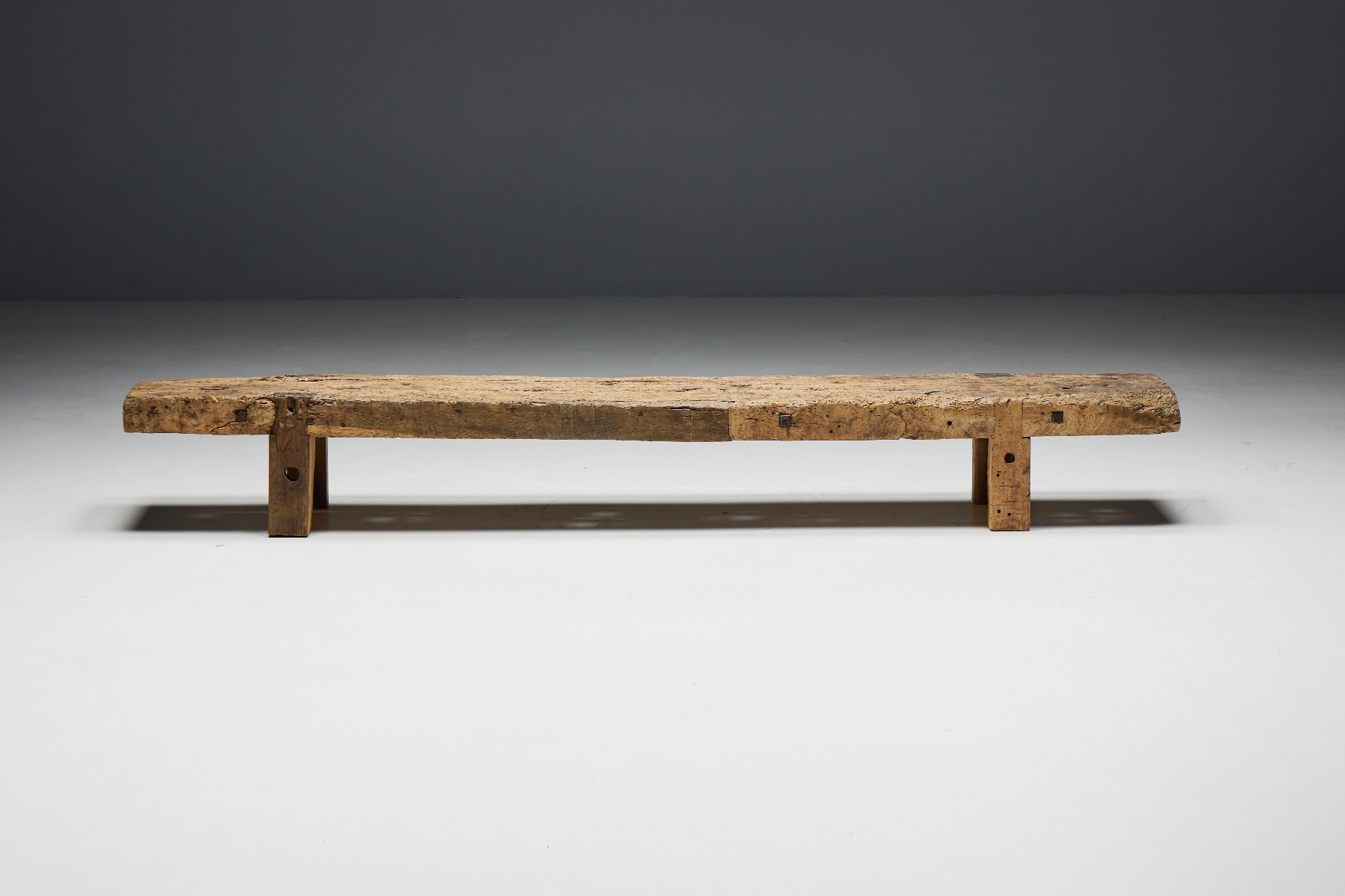 Primitive solid wood bench with organic design