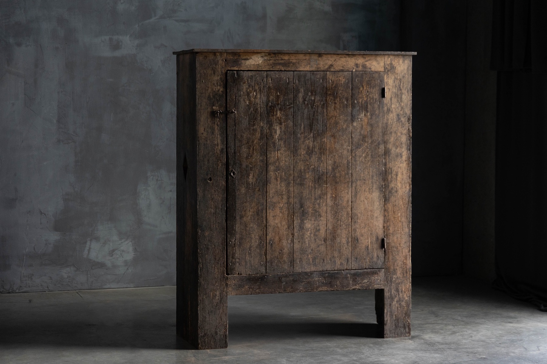 Primitive rural cupboard in Travail Populaire style
