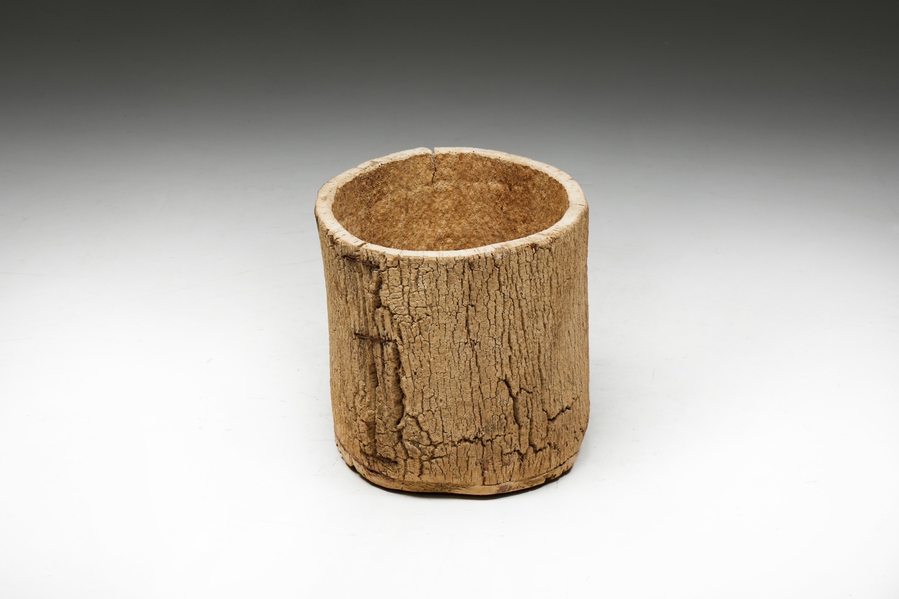 Primitive wooden basket in tree trunk style