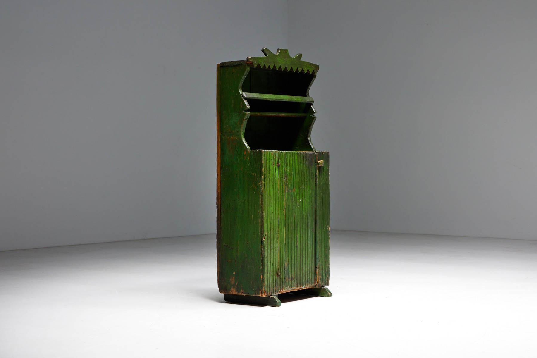 Primitive wooden cabinet in folk style