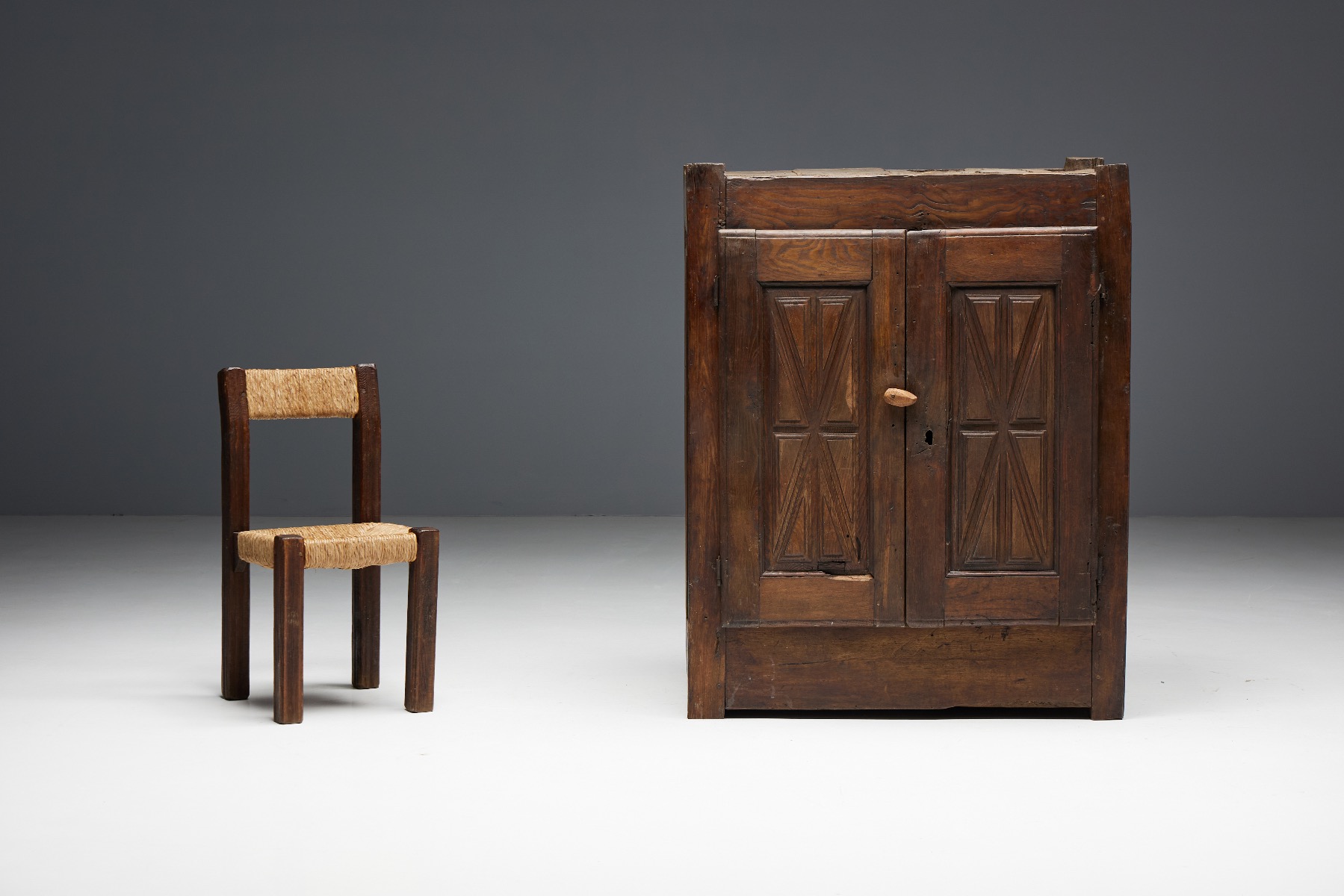 Primitive wooden cupboard in folk style
