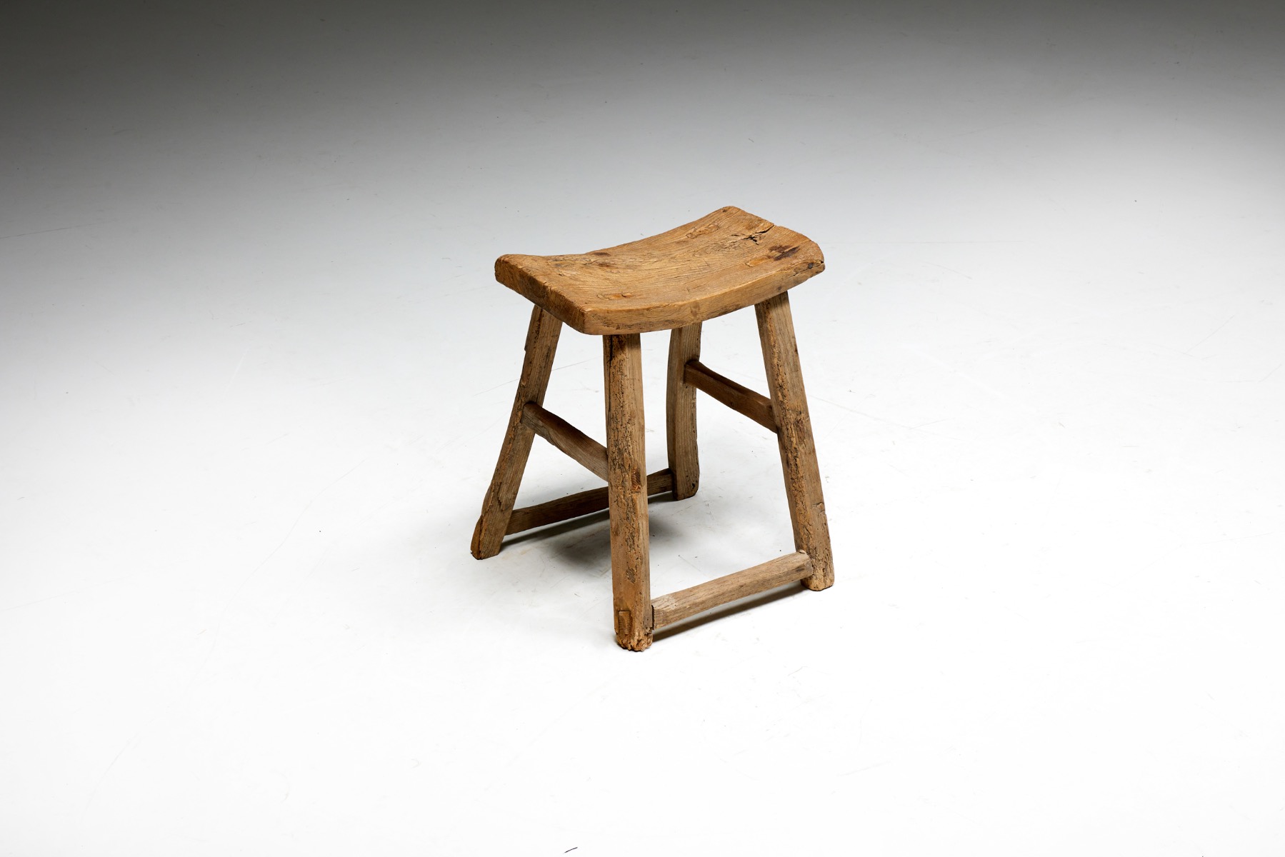 Primitive wooden stool in folk style