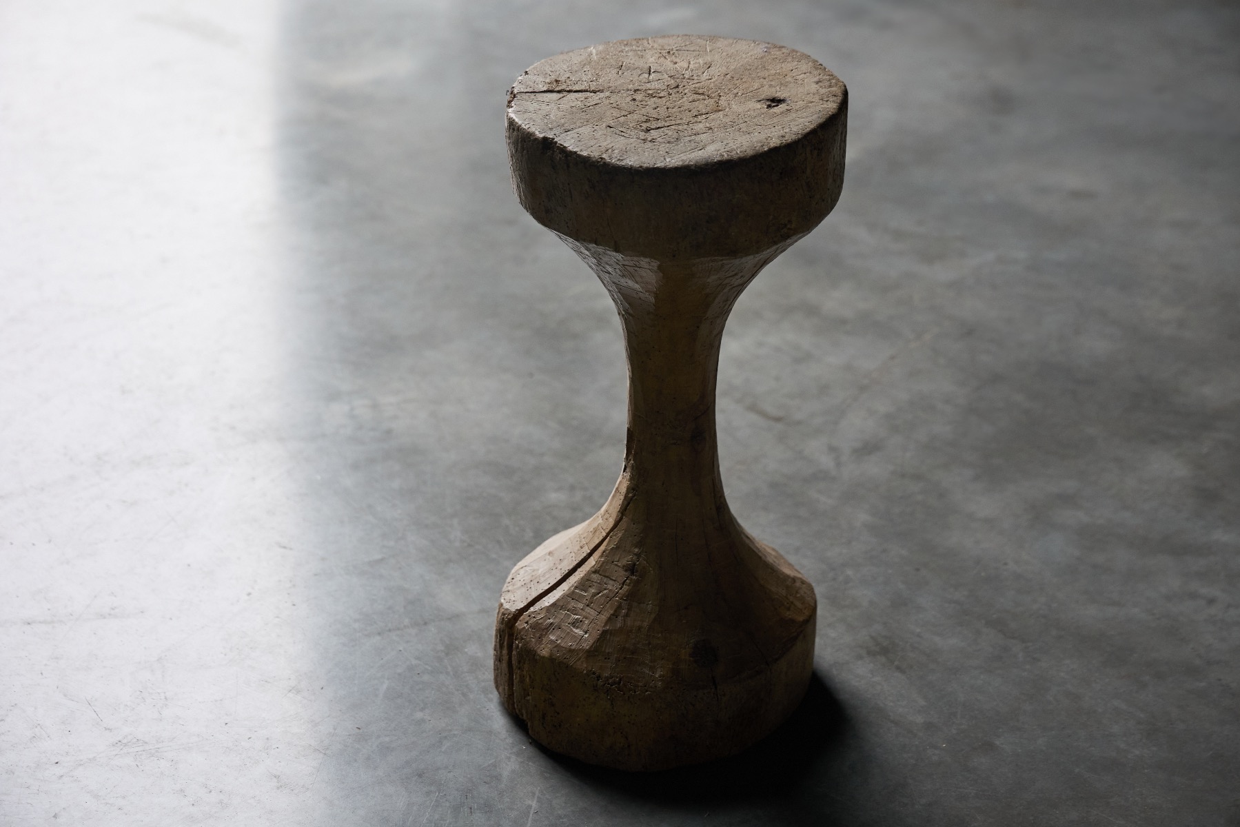 Rustic handcrafted stool with wabi sabi character